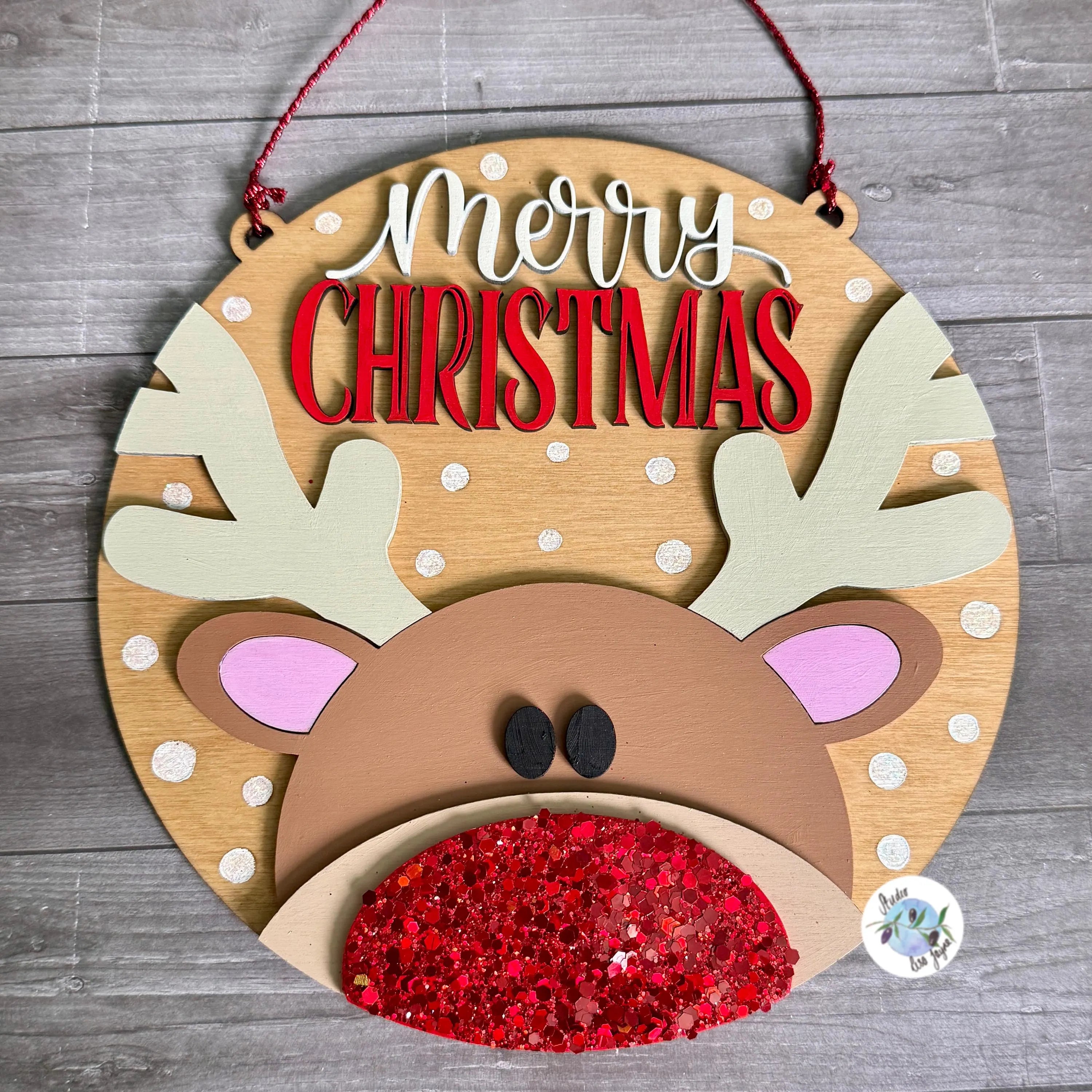 Wooden reindeer head decoration with 'Merry Christmas' text with a glittery nose