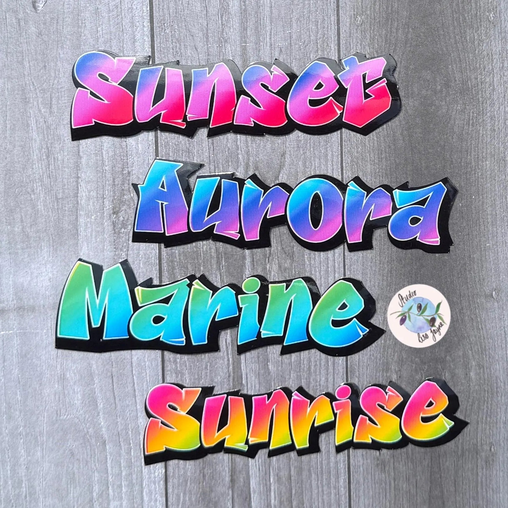 Colorful sharp graffiti labels on a wooden background 