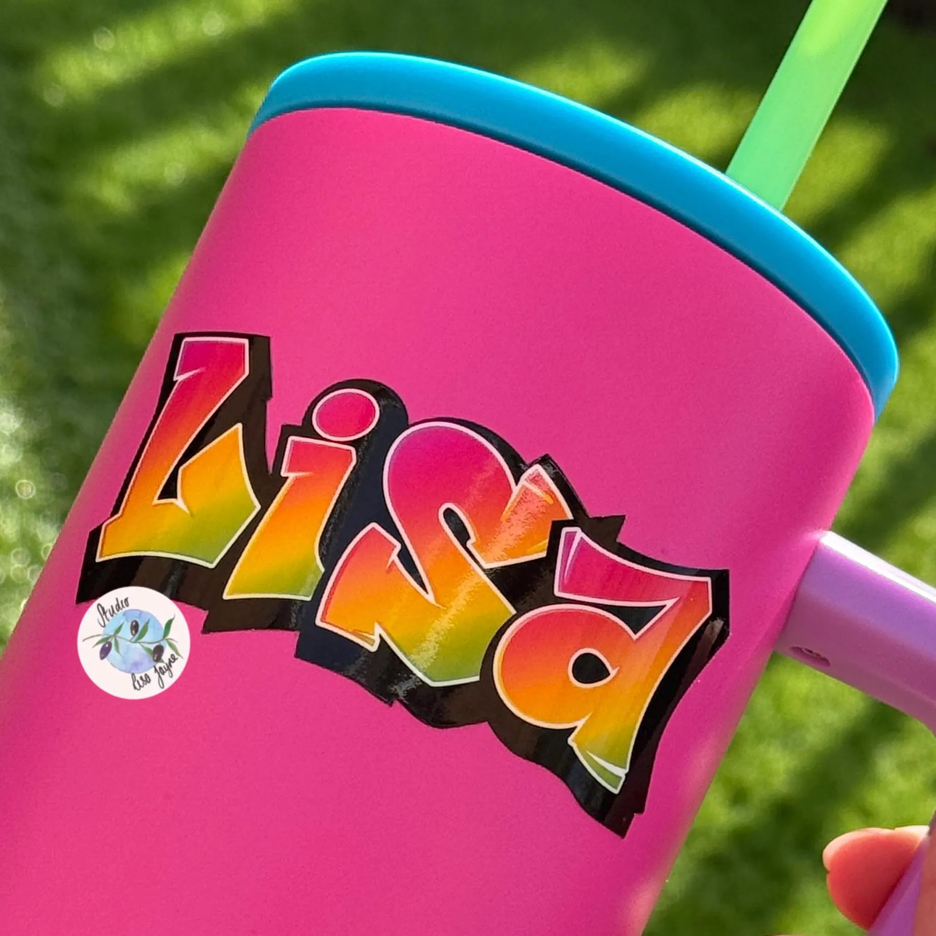Pink tumbler with colorful graffiti 'Lisa' design 