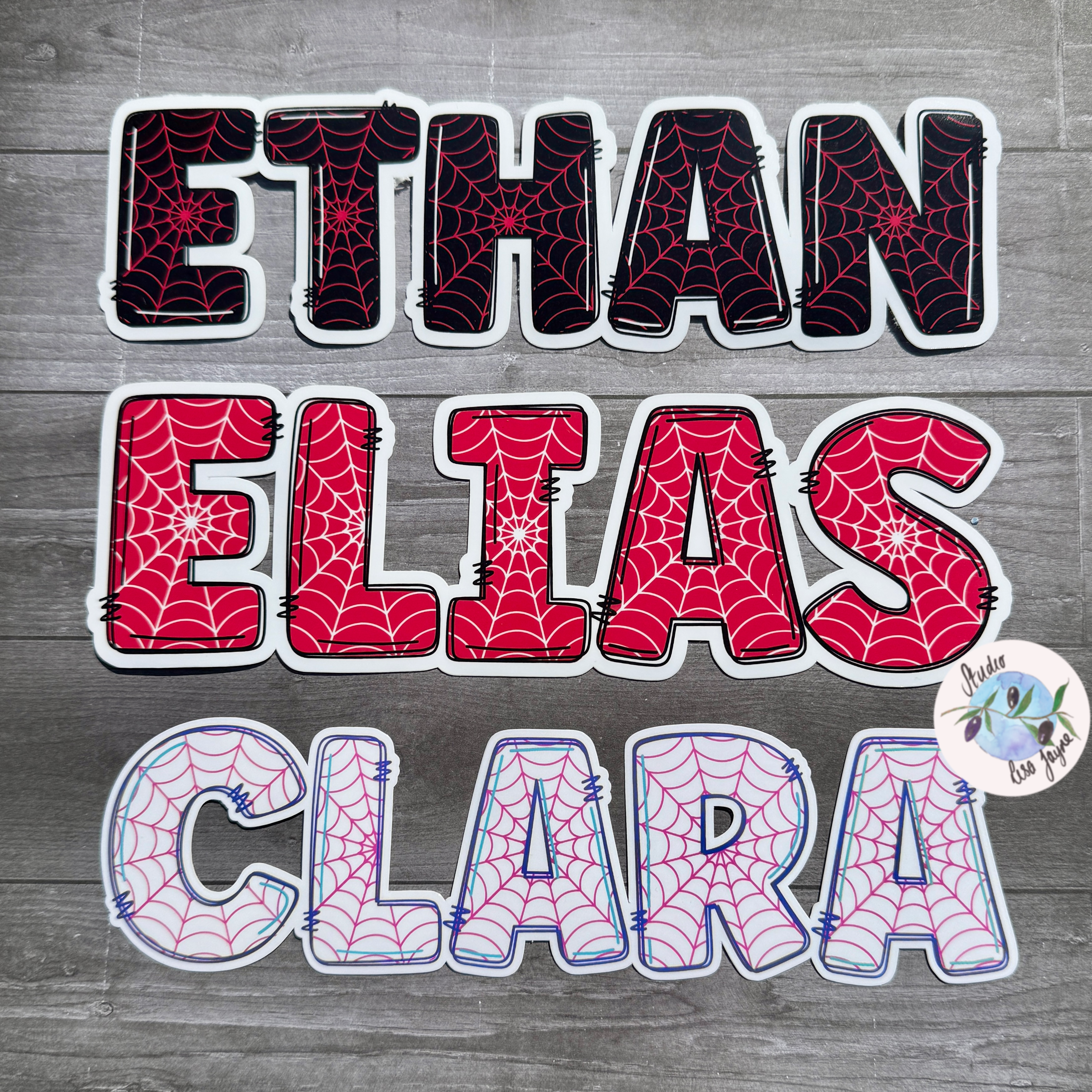 Spider man and woman themed personalised name stickers.  Available in Red, Black and Pink.  Waterproof vinyl labels