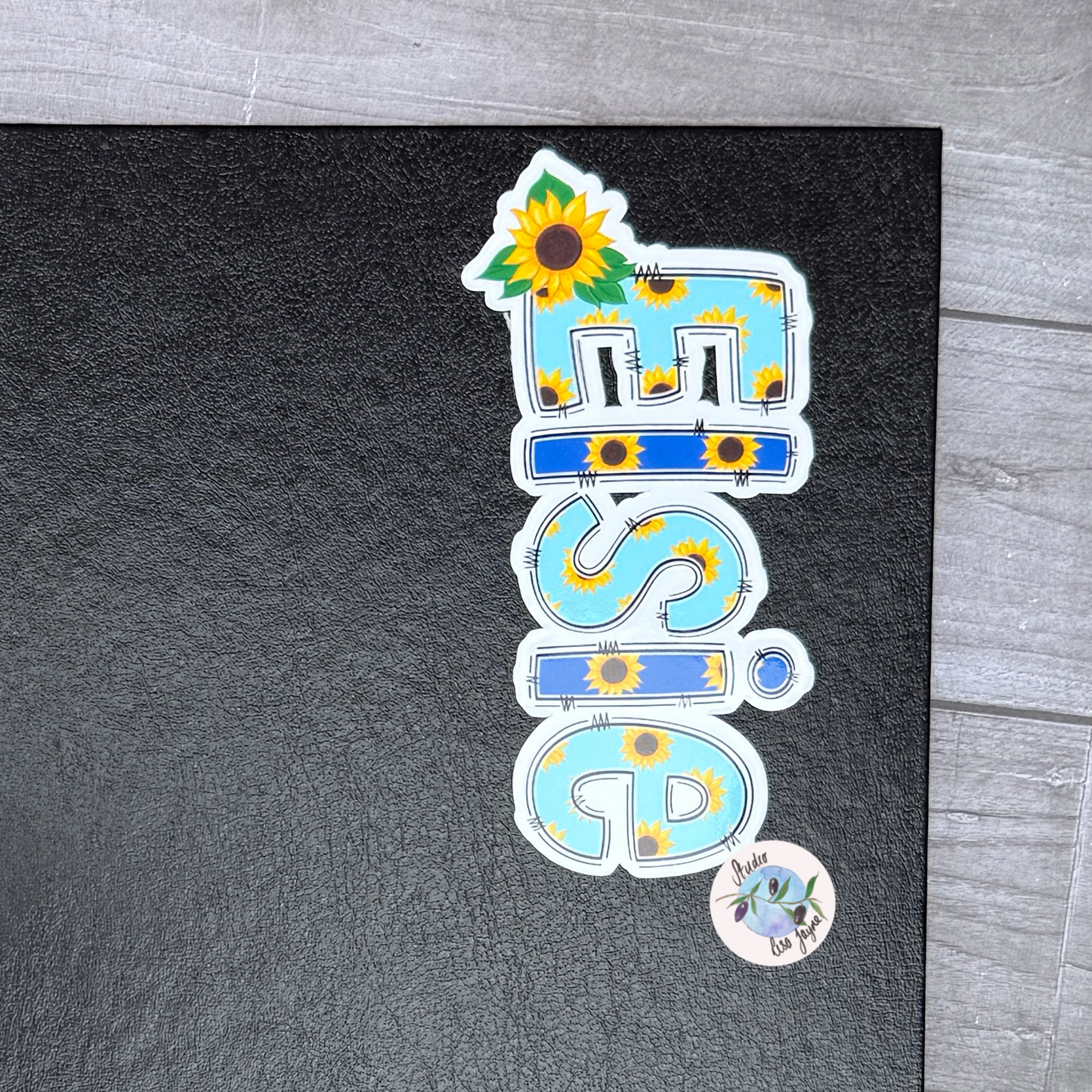 Name Sticker with sunflower design on a black journal