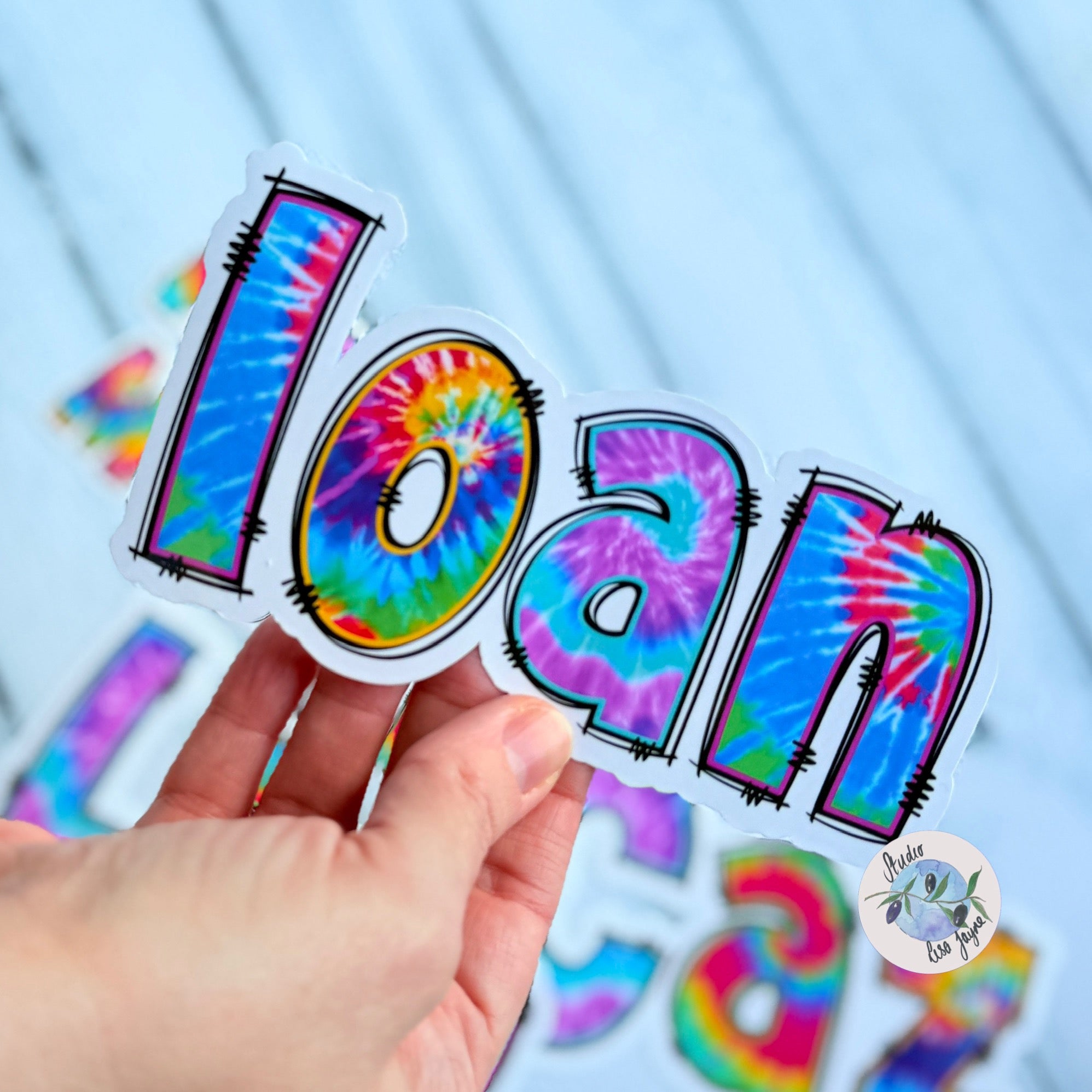 Waterproof Vinyl Tie Dye Name Sticker held in hand