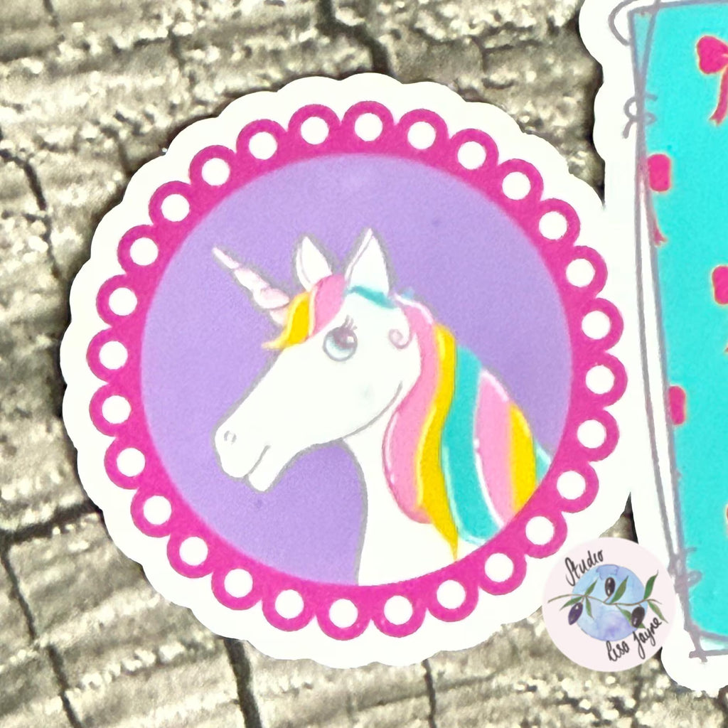 Sticker of a unicorn with a colourful mane on a textured surface