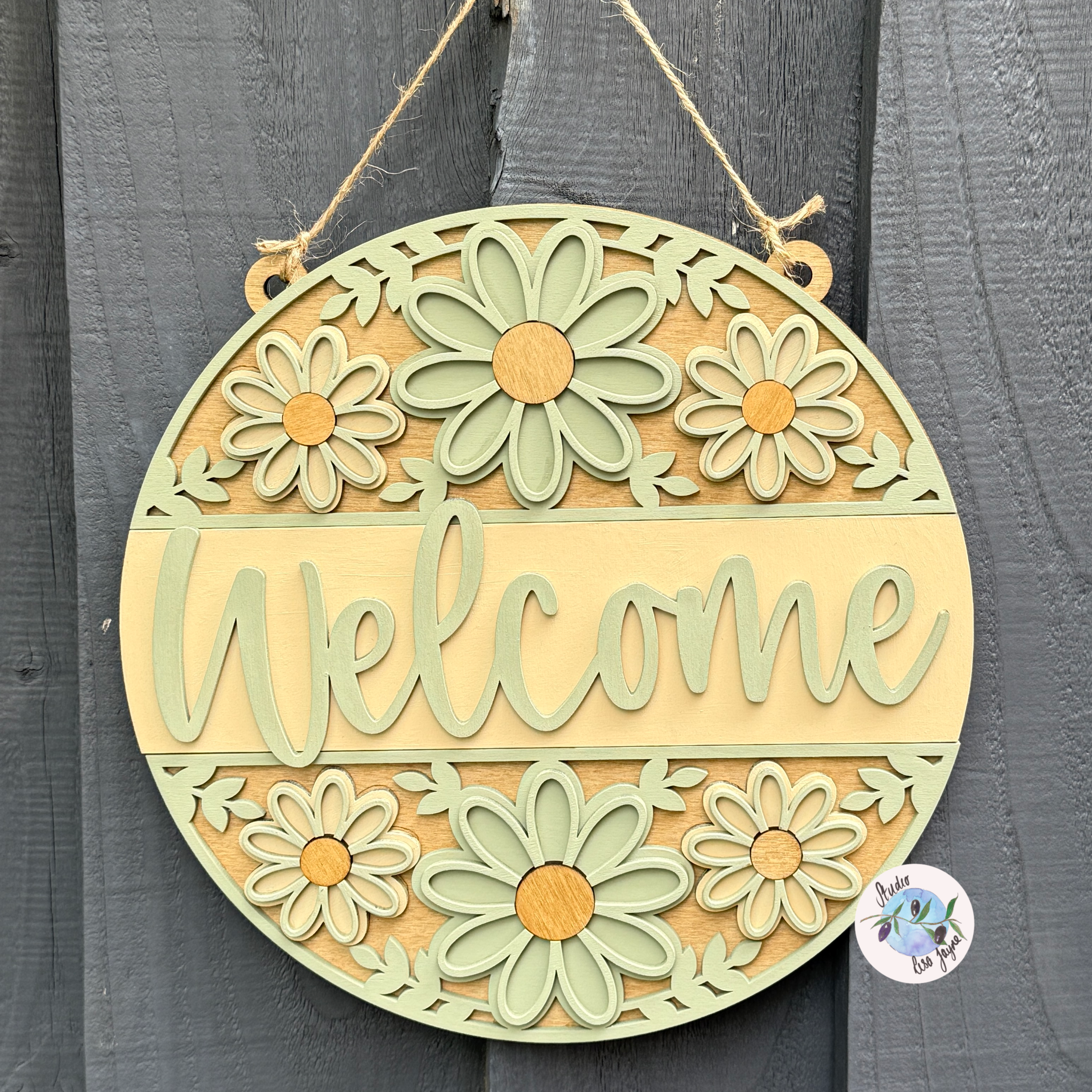 Welcome/Croeso Floral Handmade Hanging Wooden Sign  - cream and green chalk paint flowers with wood stained accents hanging on a simple grey background