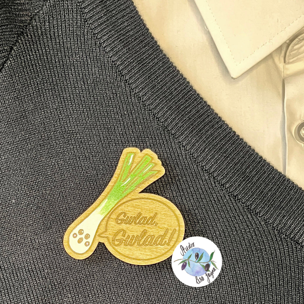 Welsh Singing Leek Wooden Brooch applied to  school jumper ready for St David's Day