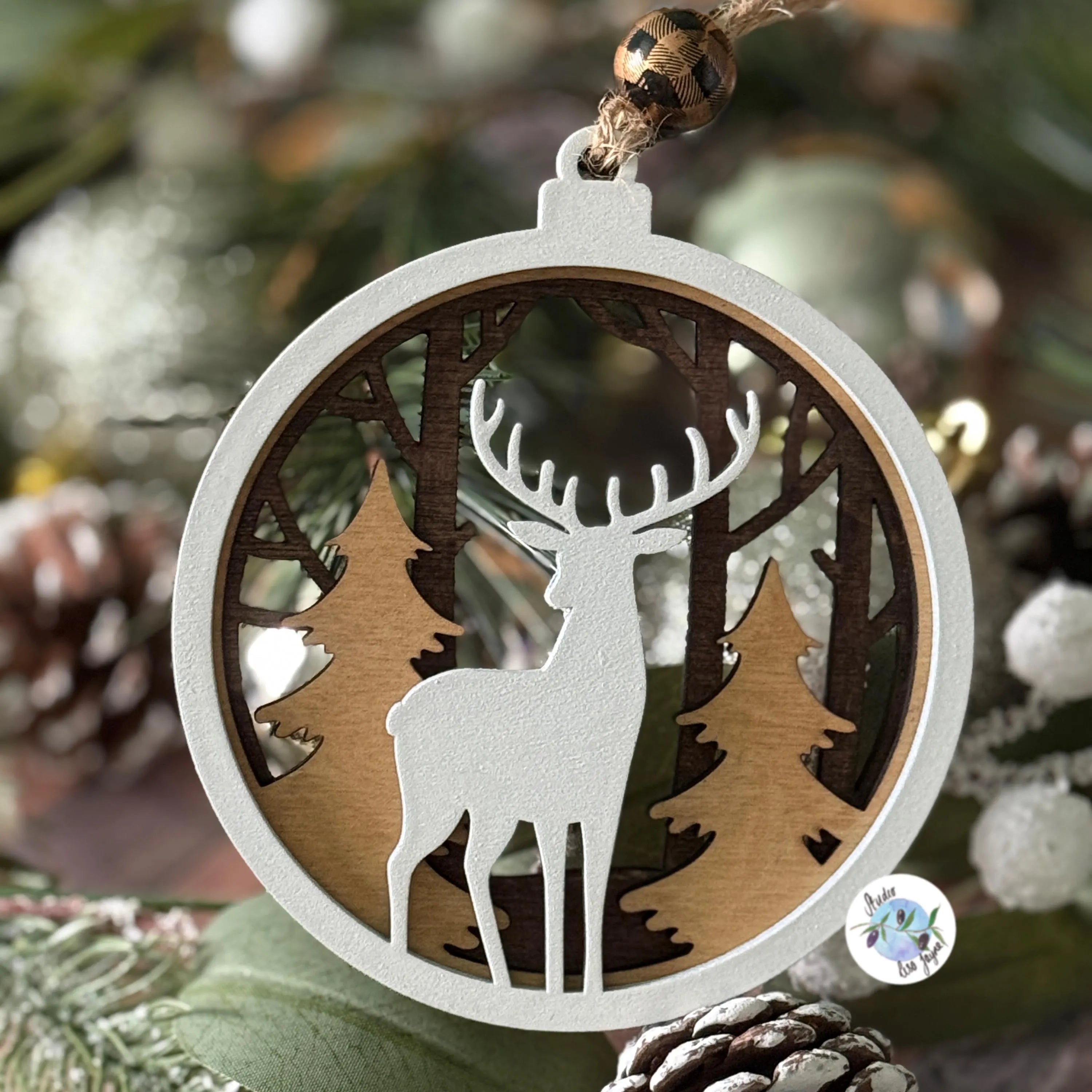 Christmas Tree Decorative ornament with a deer and forest design on a tree.  Hand painted