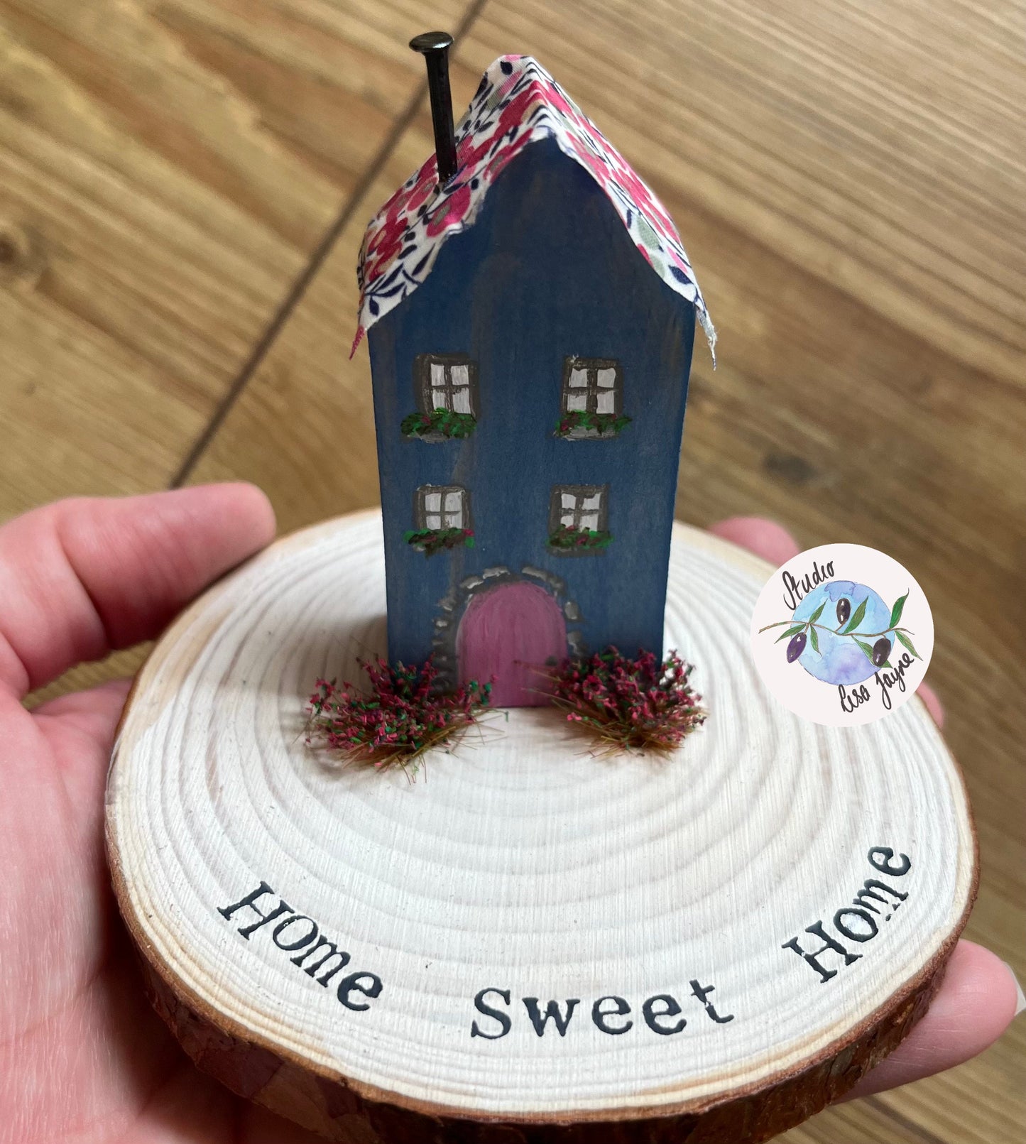 Miniature Rustic Style Wooden House on Log Slice