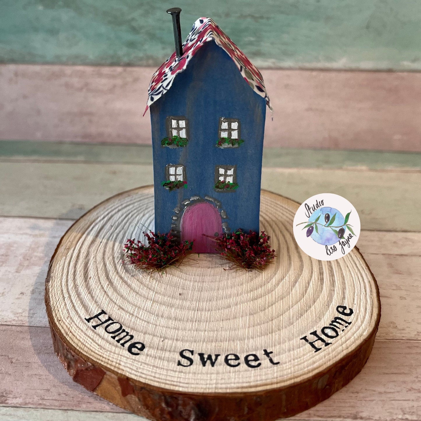 Miniature Rustic Style Wooden House on Log Slice