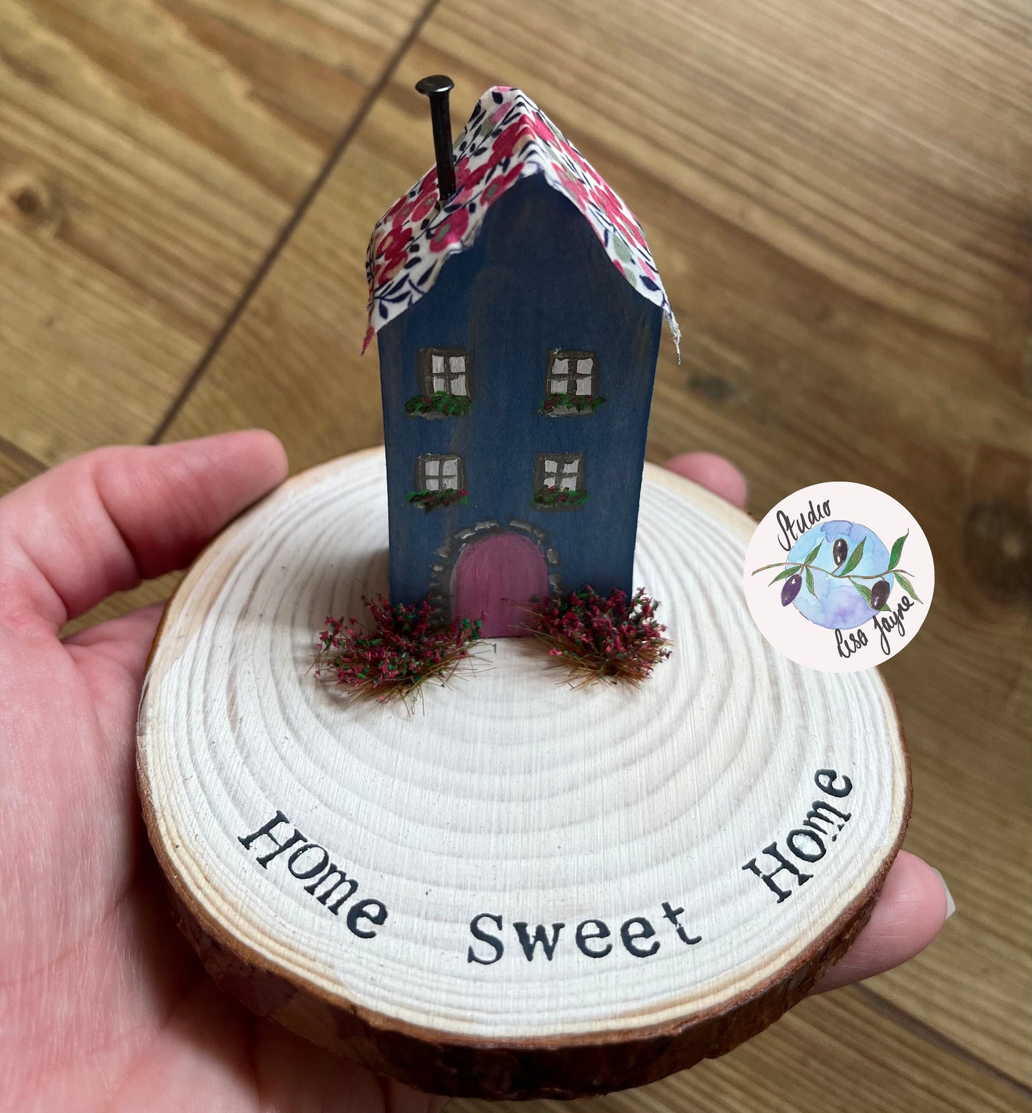 Miniature Rustic Style Wooden House on Log Slice