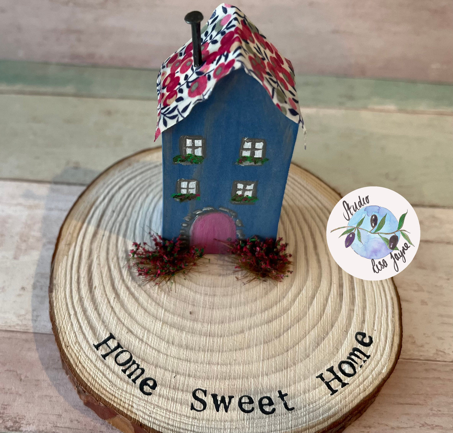 Miniature Rustic Style Wooden House on Log Slice