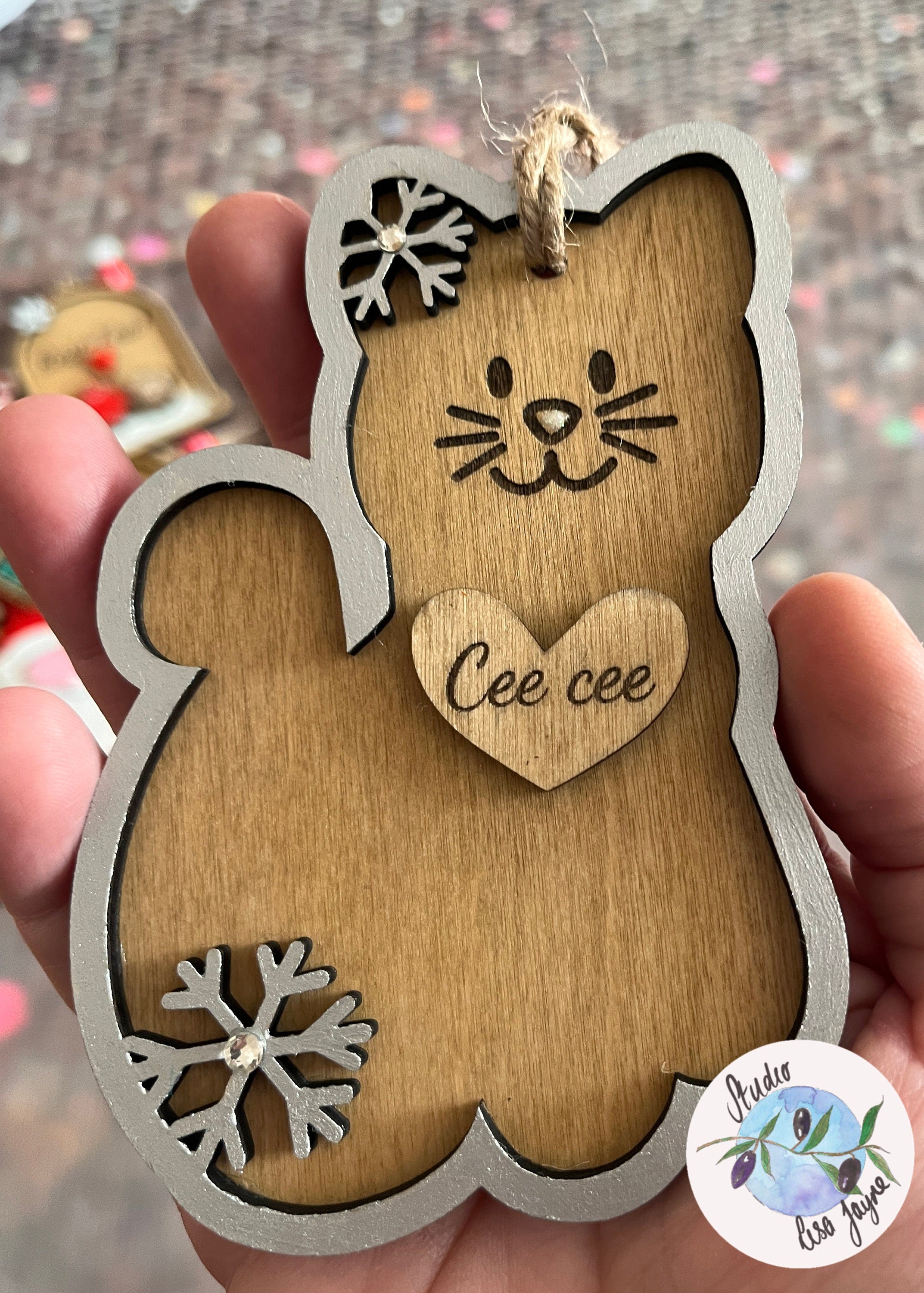 Personalised Cat or Dog Pet Christmas Decoration - silver cat in hand for scale