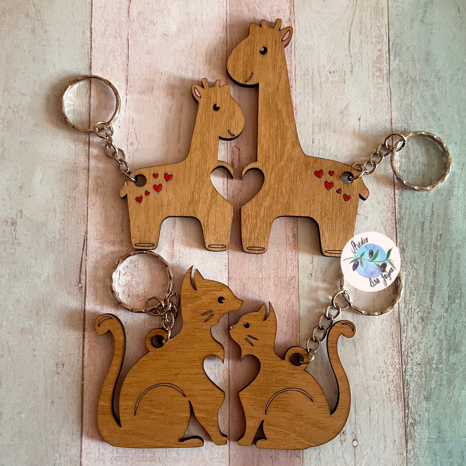 Love anniversary animal pair keyrings jigsaw valentines day - giraffes, cats - close up