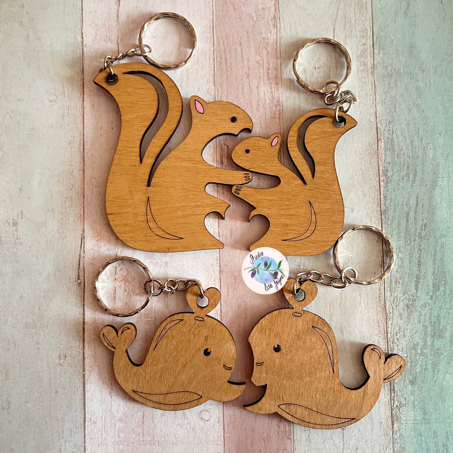 Love anniversary animal pair keyrings jigsaw valentines day - squirrels, whales - close up