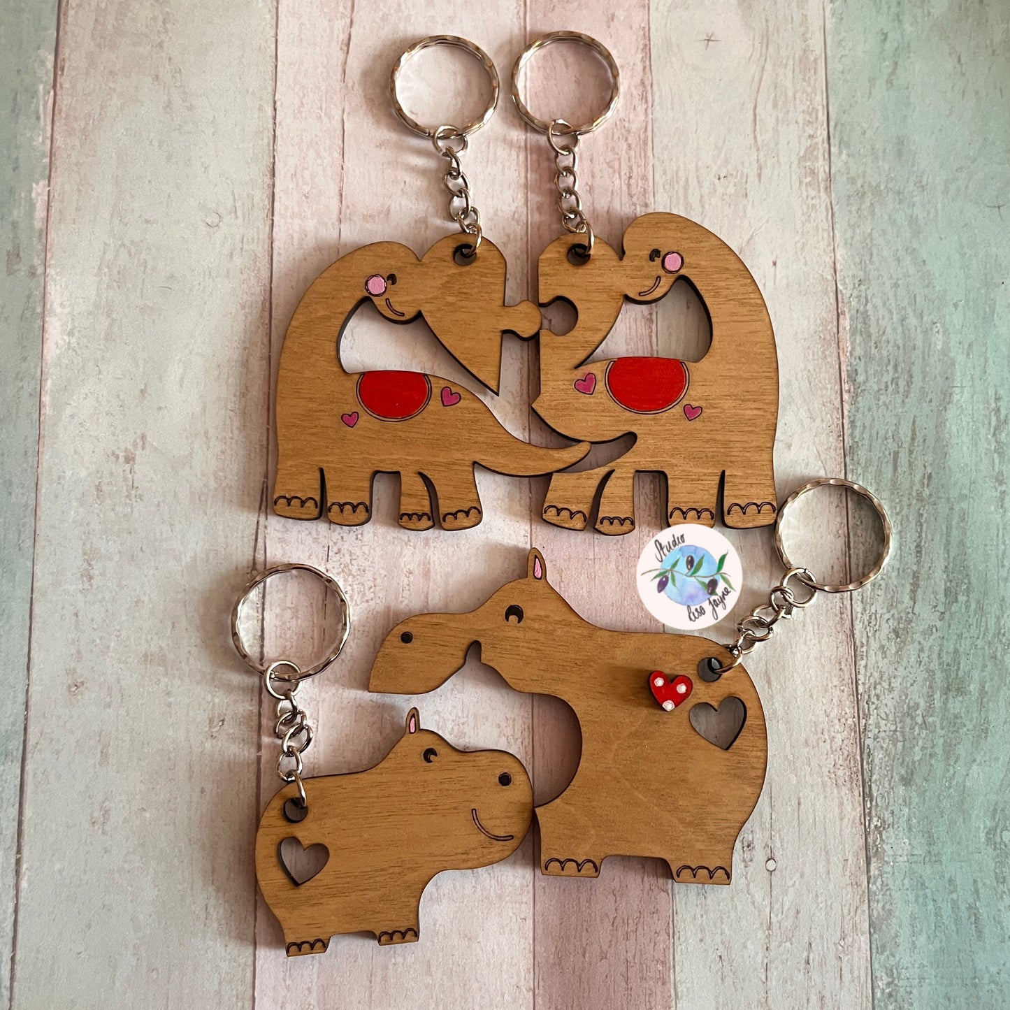 Love anniversary animal pair keyrings jigsaw valentines day - dinos, dinosaurs, hippos - close up