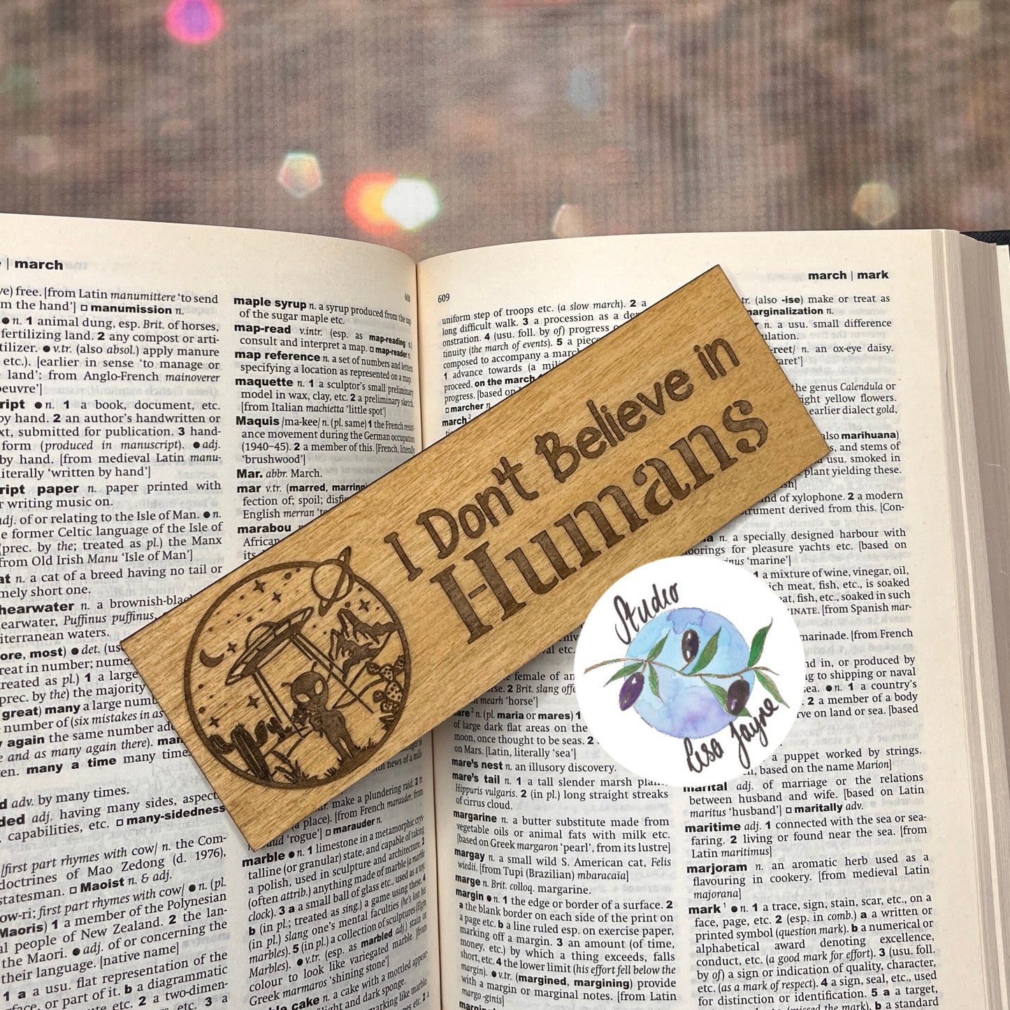 Kids alien bookmarks with the message I don't believe in humans - boy girl - open book