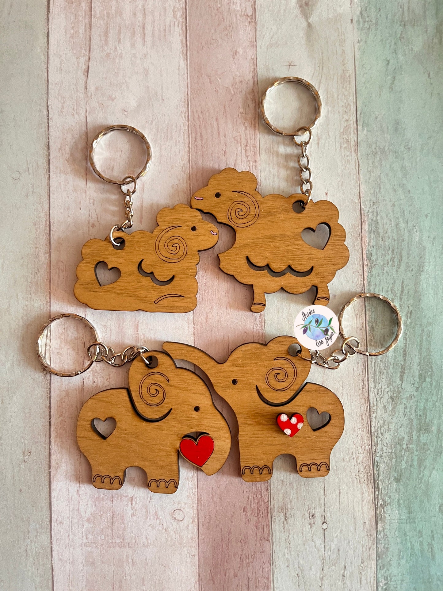 Love anniversary animal pair keyrings jigsaw valentines day - sheep, elephants - close up