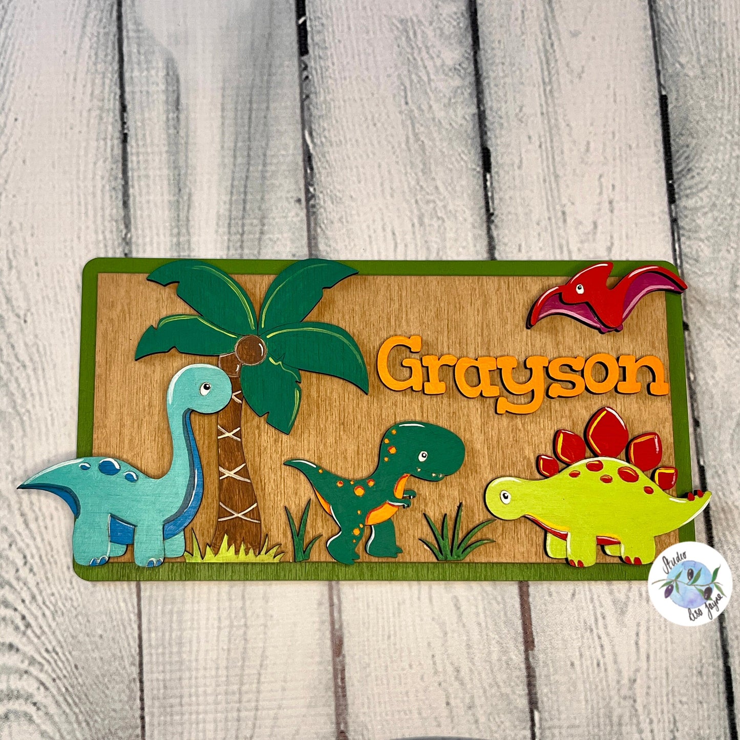 Dinosaur personalised kids name plaque sign plate.  Colourful hand painted children’s bedroom door - close up