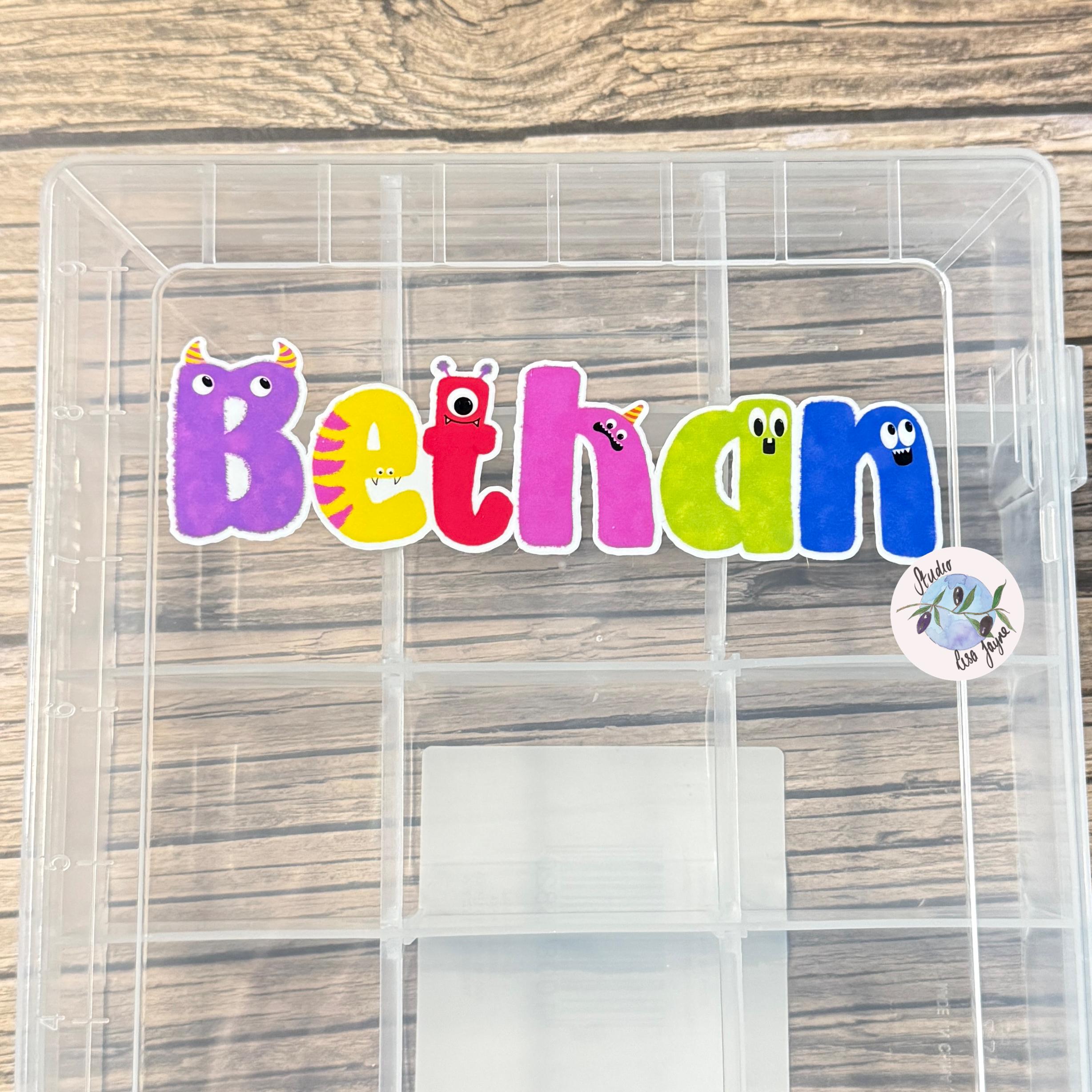 Monster Name Sticker for Smooth Surfaces - a plastic container with a name sticker on it
