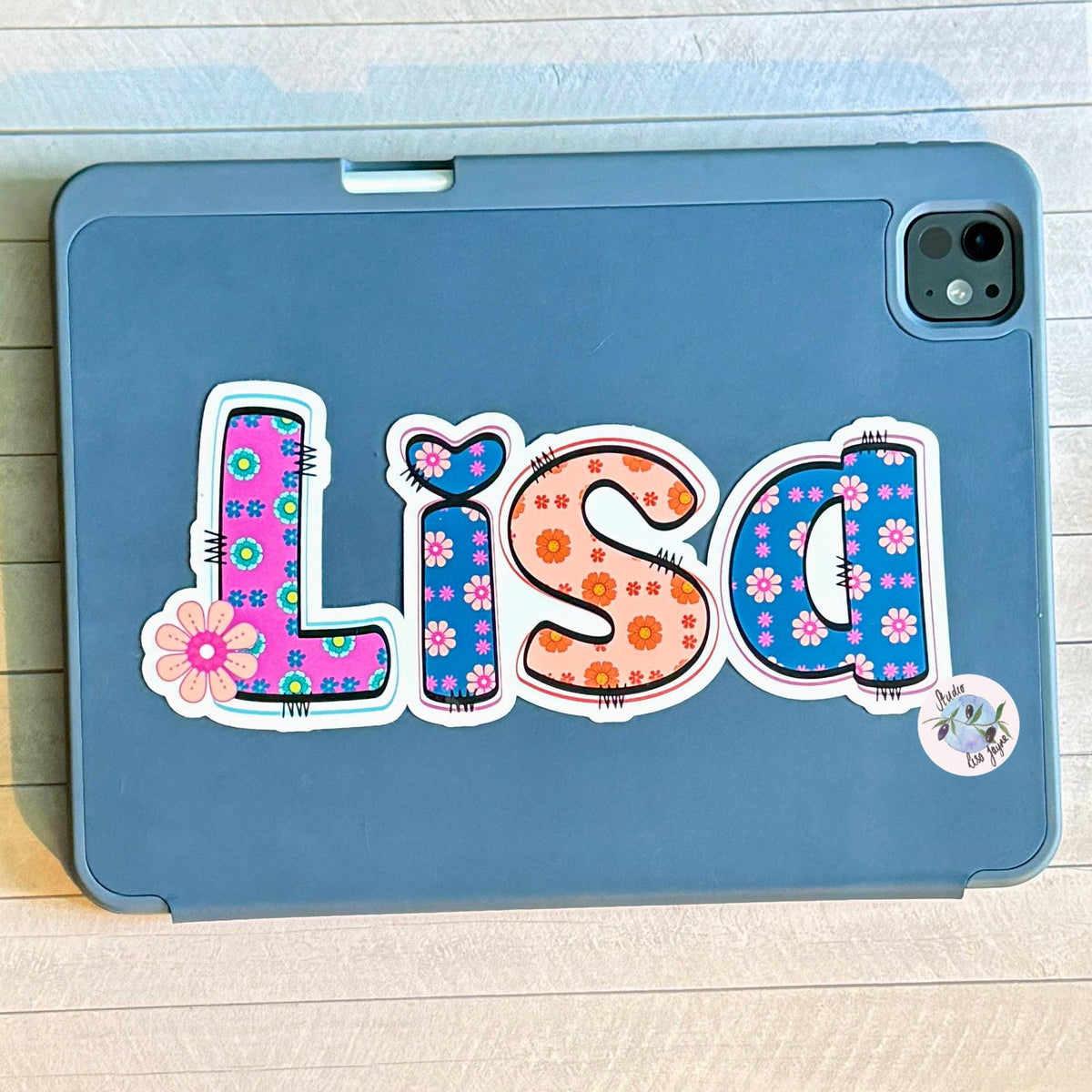 Retro Floral Personalised Name Waterproof Vinyl Sticker For Smooth Surfaces - a blue tablet case with a name sticker on it