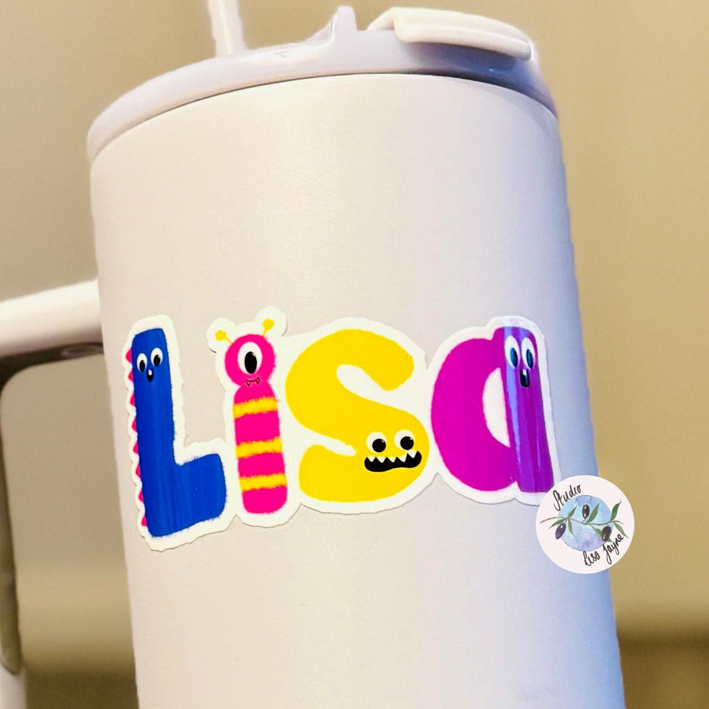 Monster Name Sticker for Smooth Surfaces - a white cup with a straw and a sticker on it