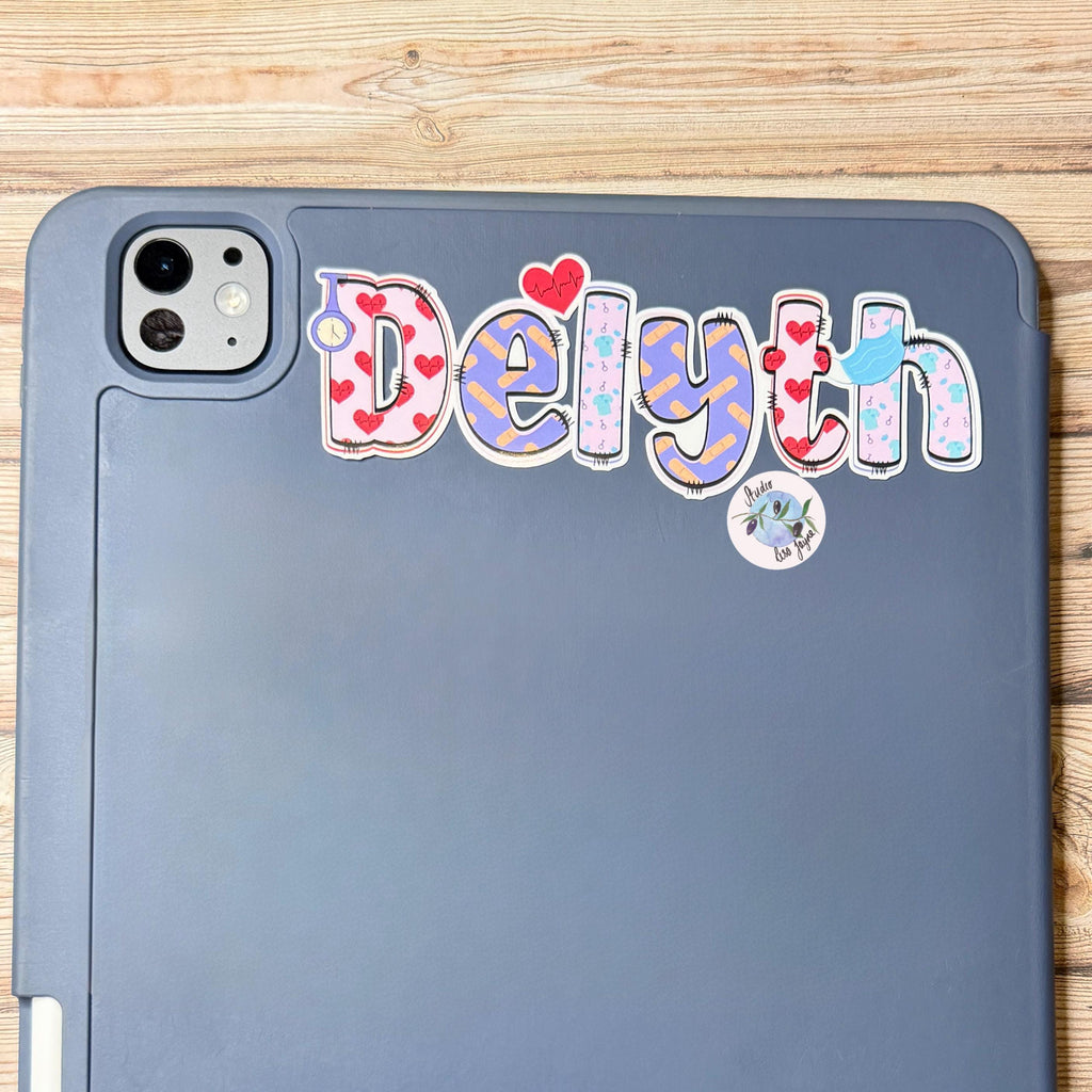 Nurse Healthcare Assistant Personalised Name Waterproof Vinyl Sticker For Smooth Surfaces - a close up of an iPad with Delyth 