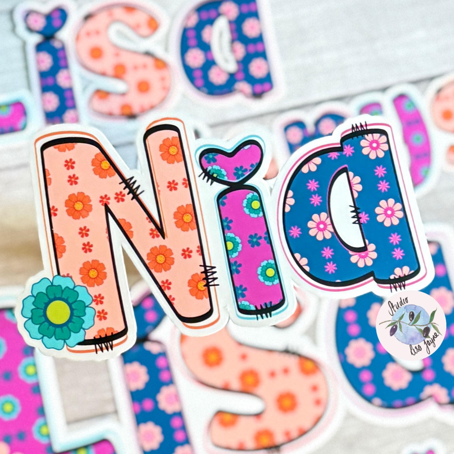 Retro Floral Personalised Name Waterproof Vinyl Sticker For Smooth Surfaces - Nia in a bright Colourful style