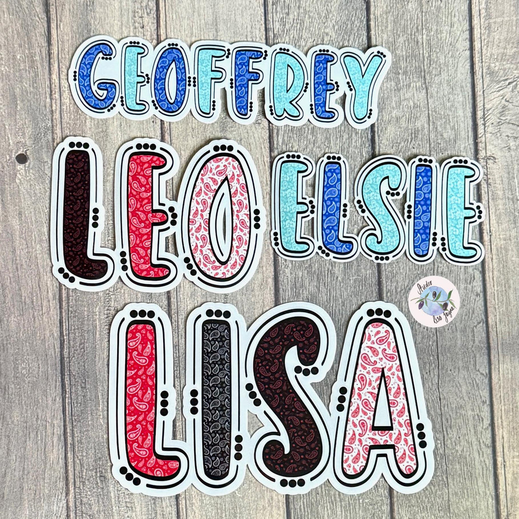 Paisley Pattern Name Sticker Label Kids - a group of colorful stickers on a wood surface