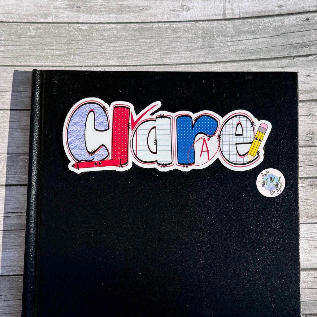 Teacher Name Sticker Label - a black book with a sticker on it