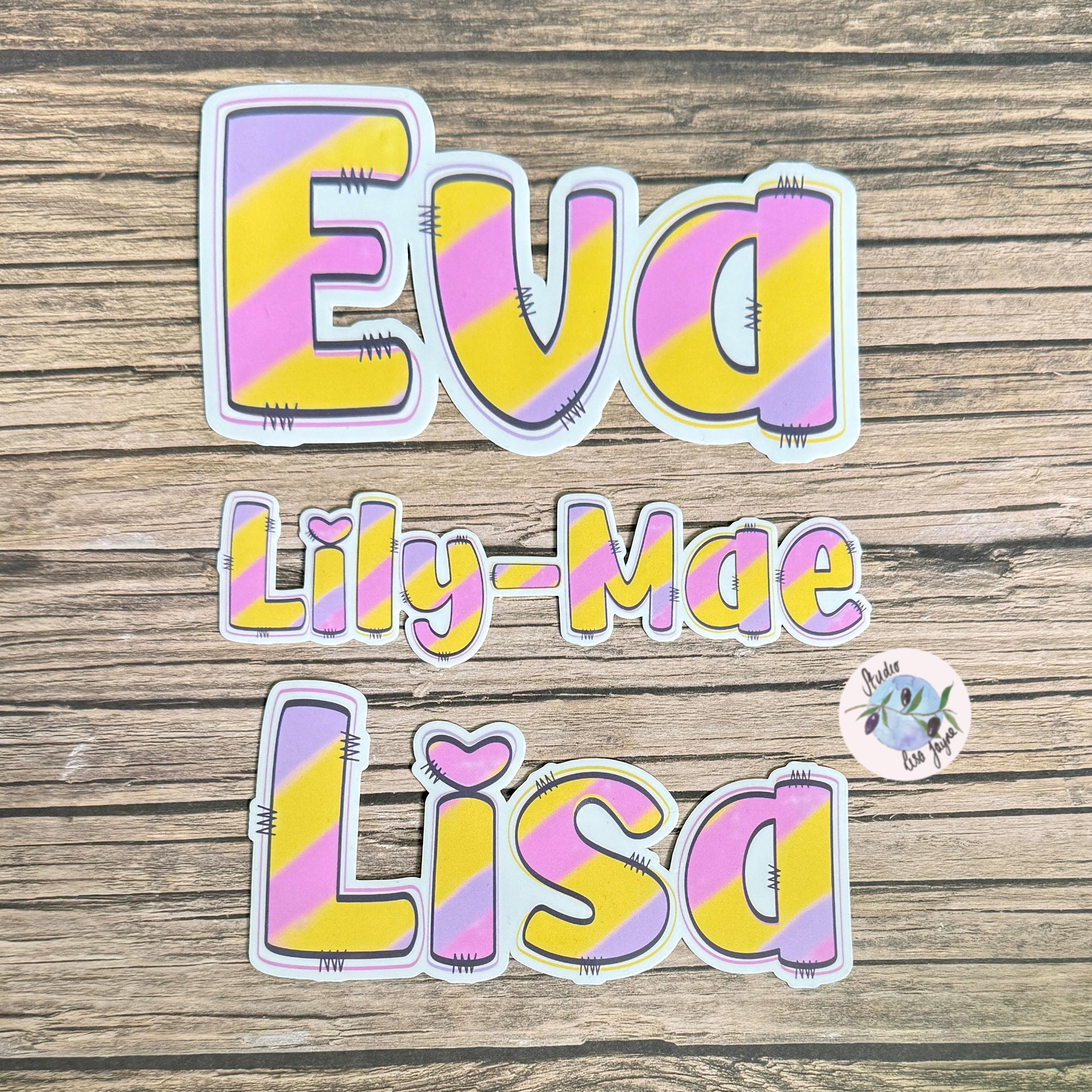 Pastel Rainbow Name Sticker Label - a group of colorful name stickers on a wood surface