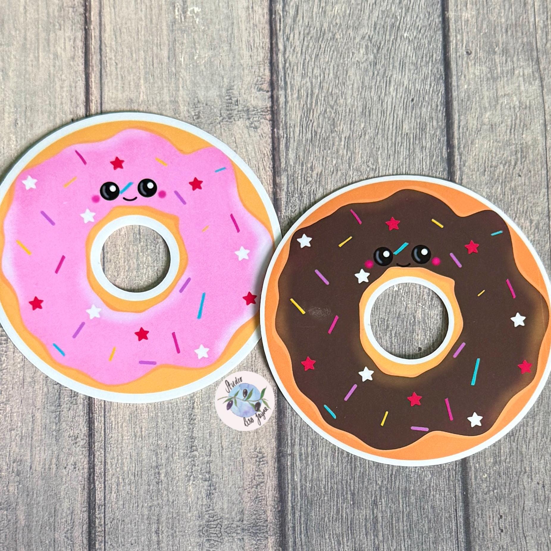 Doughnut Donut Hand Illustrated Waterproof Vinyl Sticker - a pair of donuts on a wood surface