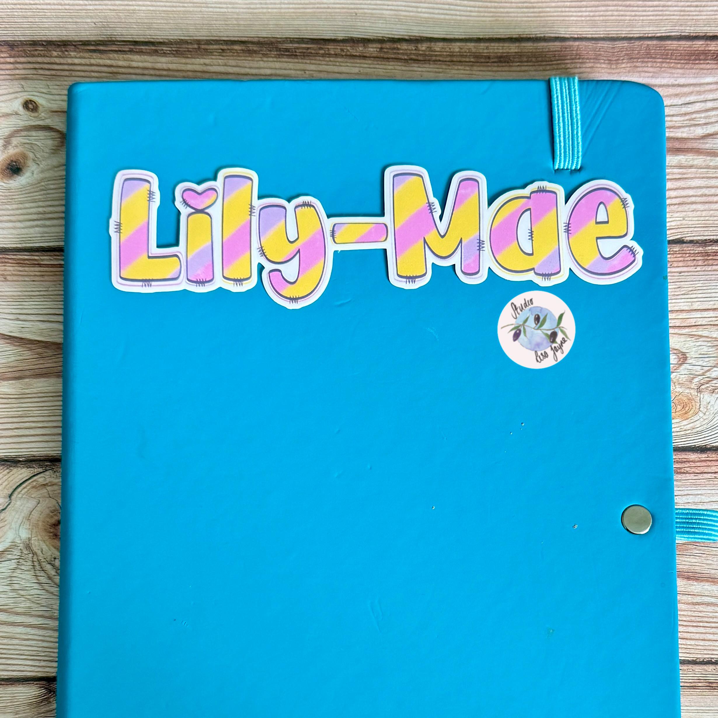 Pastel Rainbow Name Sticker Label - a blue notebook with a name tag on it