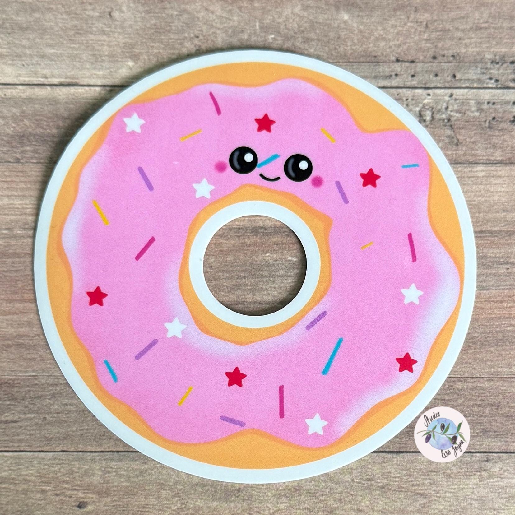 Doughnut Donut Hand Illustrated Waterproof Vinyl Sticker - a pink donut with sprinkles on a wood surface