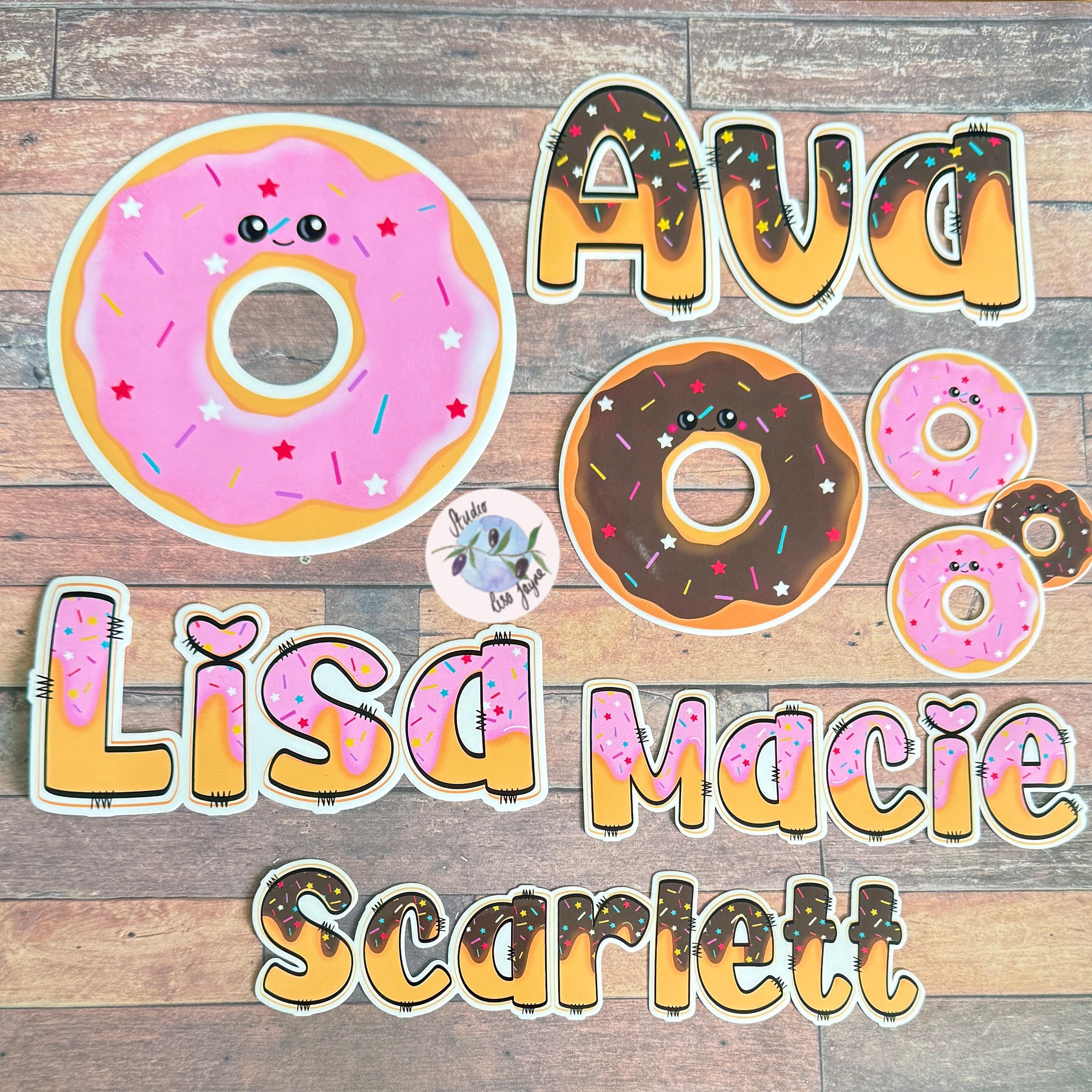 Doughnut Donut Hand Illustrated Waterproof Vinyl Sticker - a group of cut out donuts on a wood surface