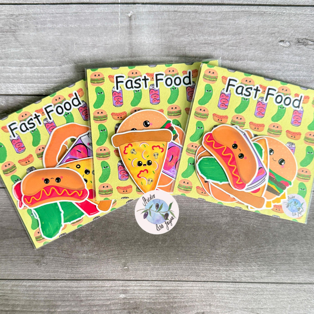 Fast Food Sticker Pack Hand Illustrated Happy Foods - a group of books on a wood surface