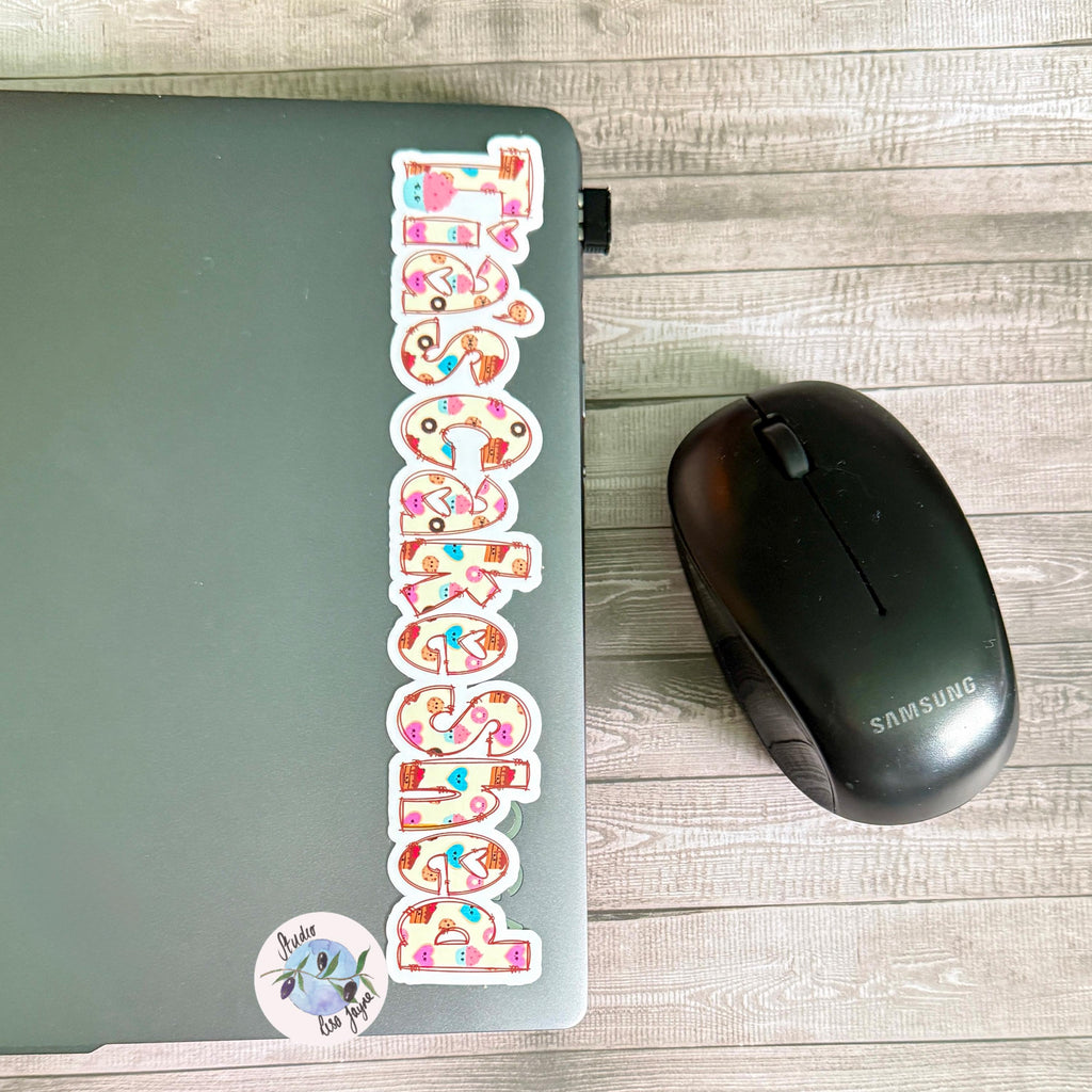 Sweet Treats Name Sticker for Smooth Surfaces - a laptop and a computer mouse