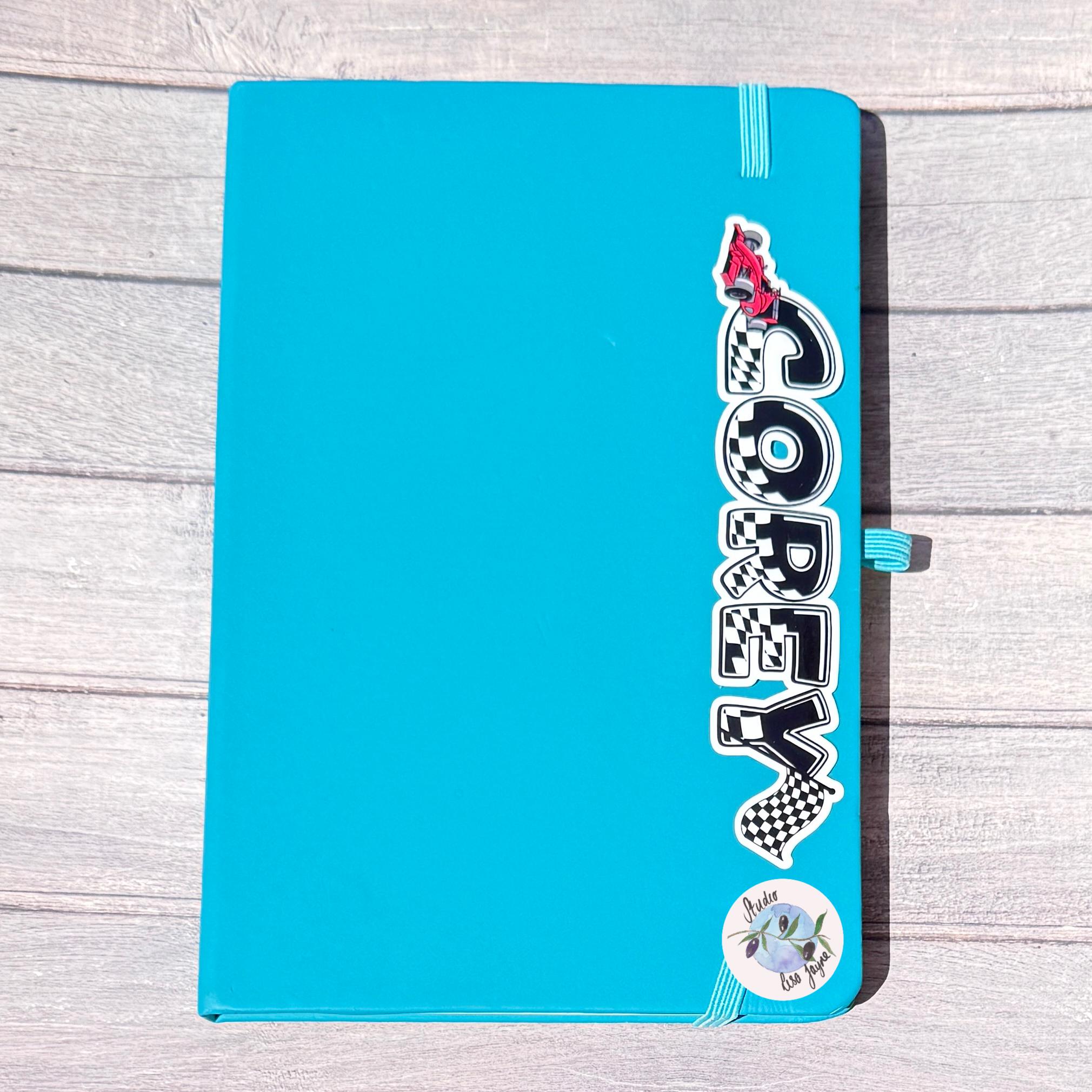 F1 Racing Car Name Sticker Label - a blue notebook with a sticker on it
