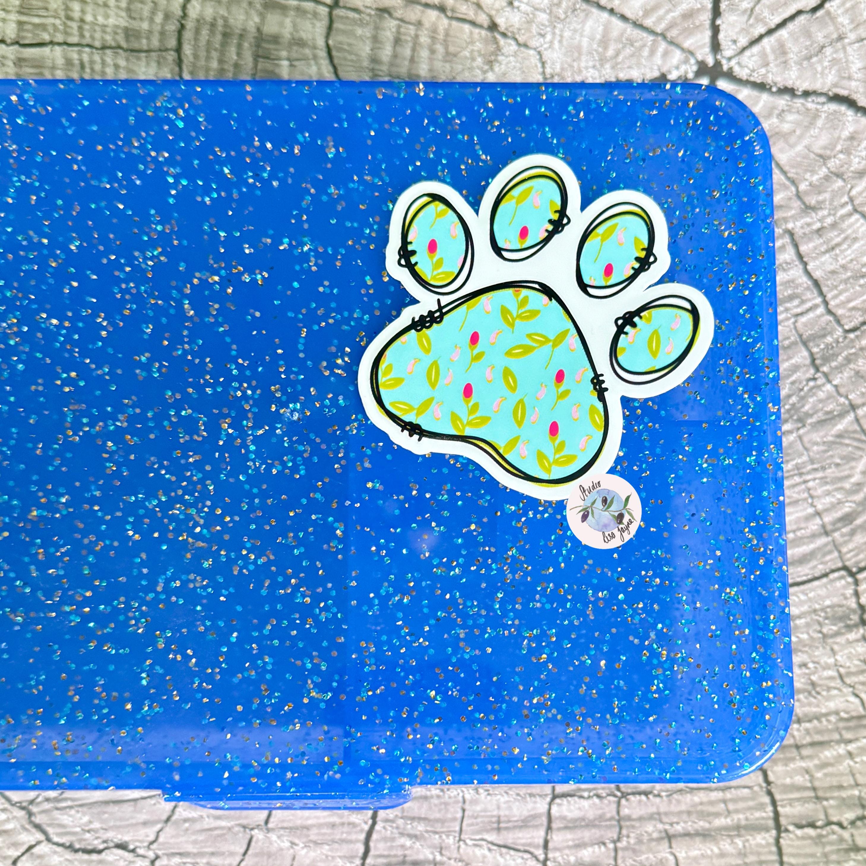 Floral Paw Print - Cat, Dog - Waterproof Vinyl Sticker - a blue lunch box with a paw print