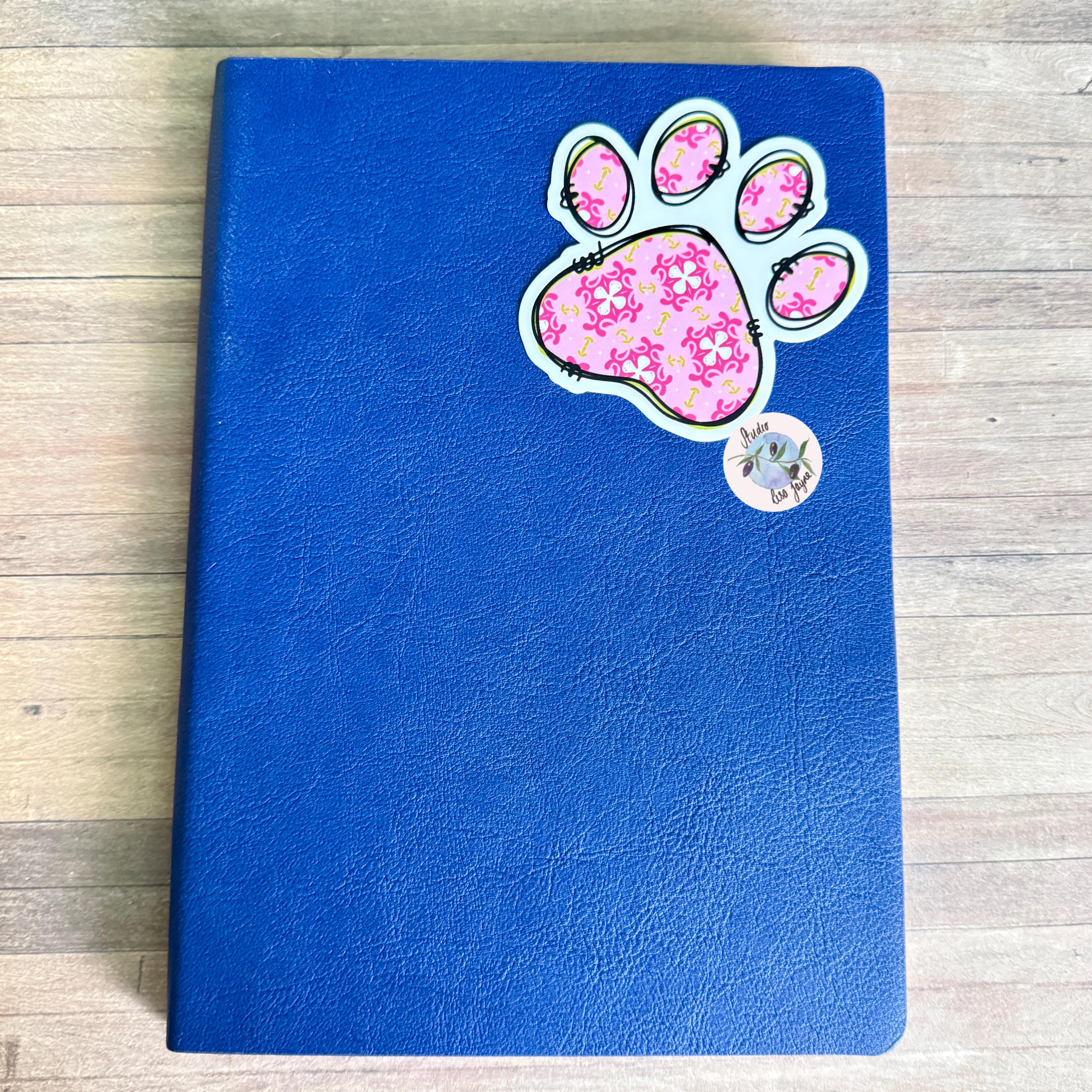 Floral Paw Print - Cat, Dog - Waterproof Vinyl Sticker - a blue notebook with a paw print on it