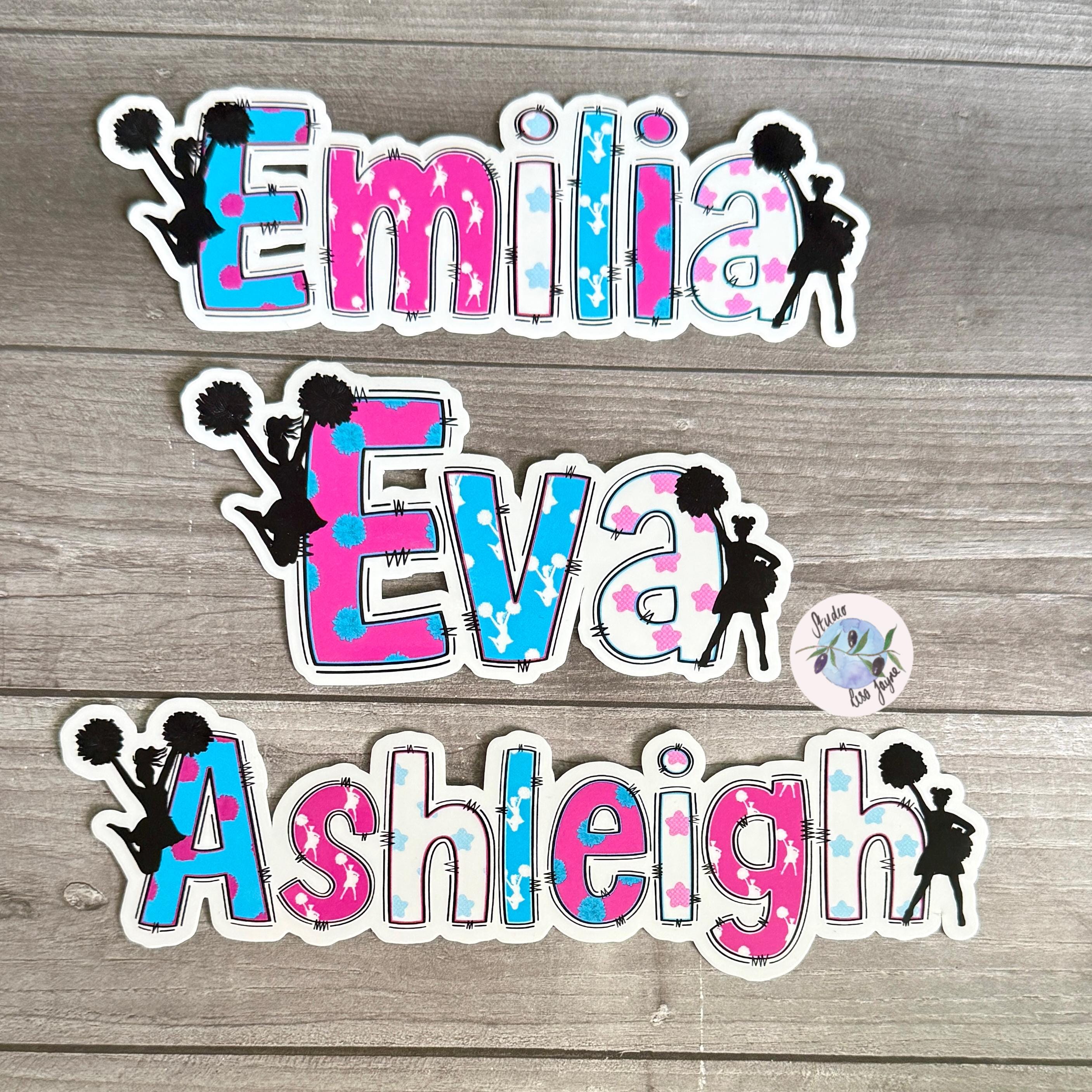 Cheerleader Name Sticker Label - a group of stickers on a wood surface with pom-poms 