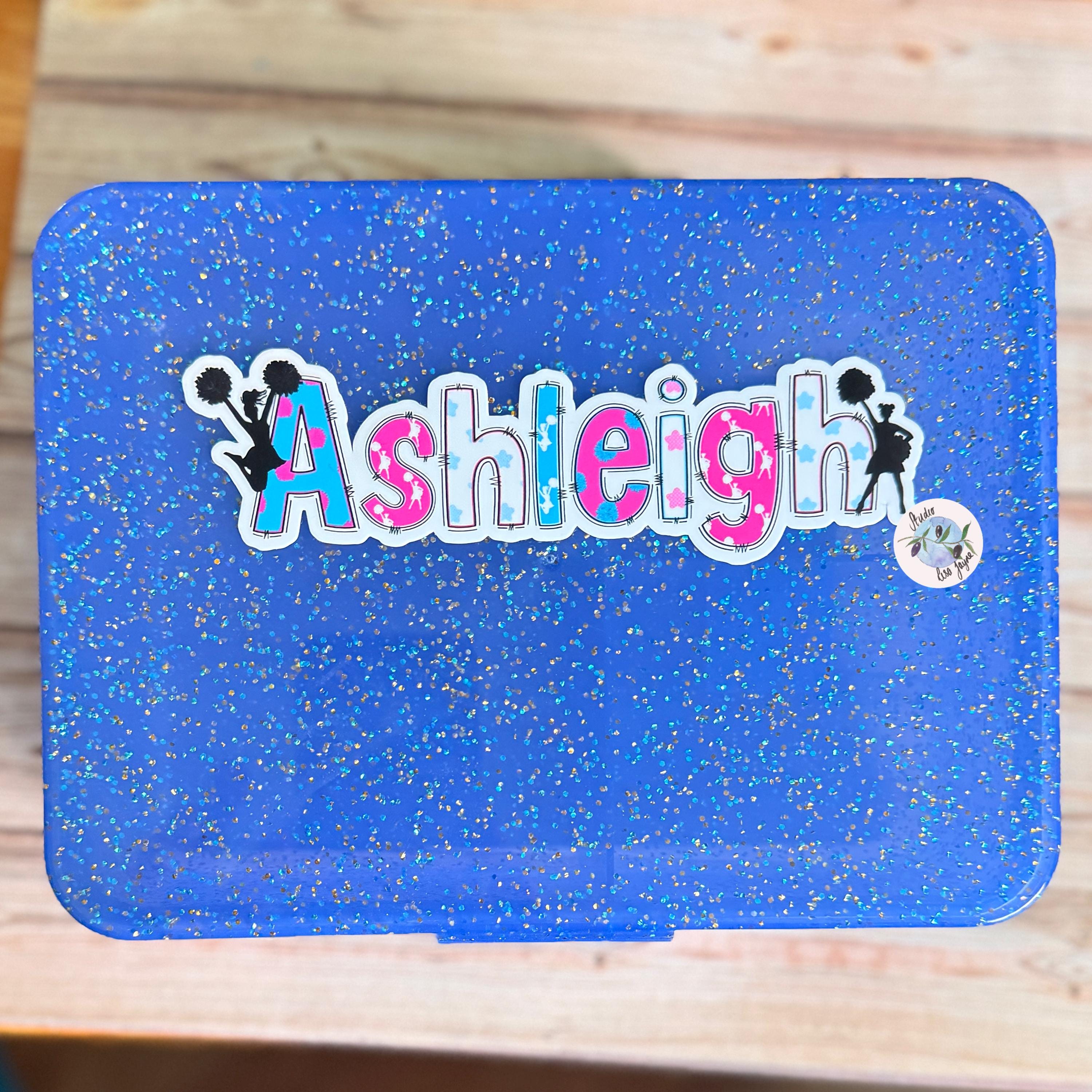 Cheerleader Name Sticker Label - a blue lunch box with Ashleigh name on it