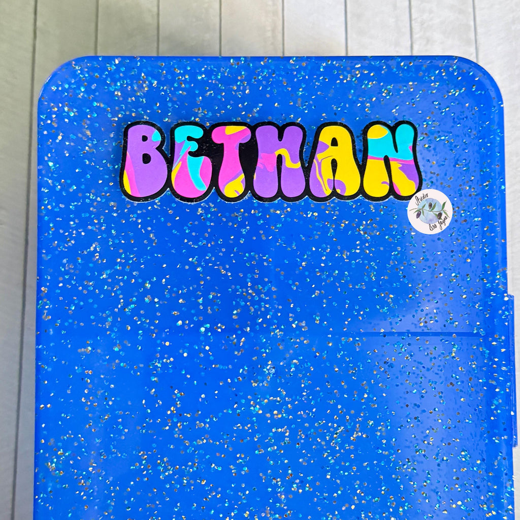 Colourful Retro Swirly Name Sticker Label - a blue container with a name sticker on it