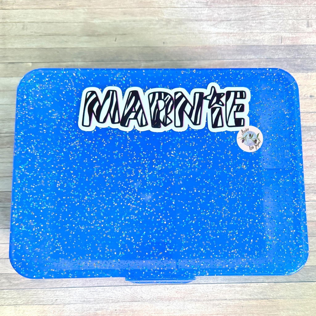 Zebra Print Name Sticker Label Kids - a blue plastic lunch box with a Marnie sticker on it