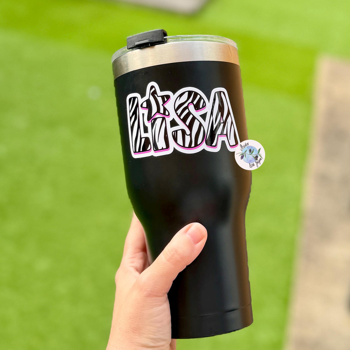 Zebra Print Name Sticker Label Kids - a hand holding a black and silver tumbler
