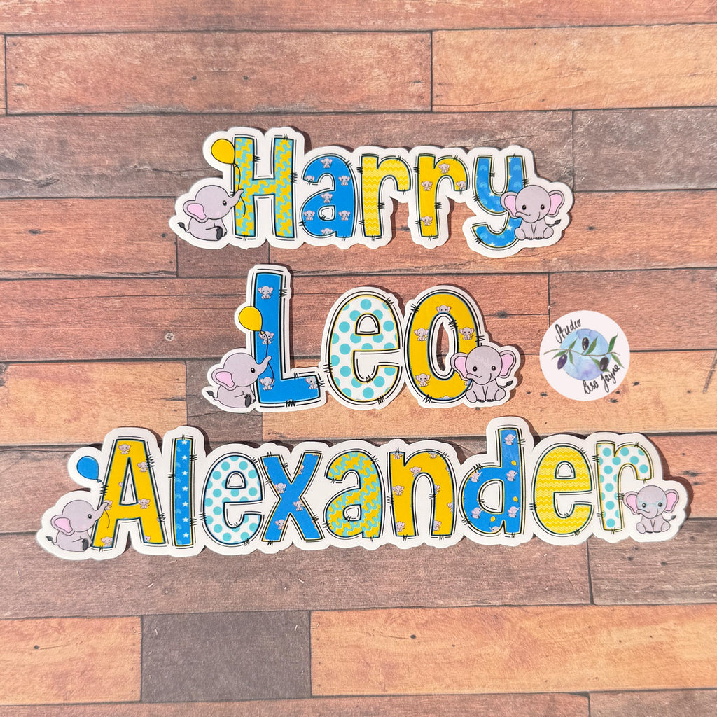 Elephants Name Sticker Label Kids - a group of children's name decals on a wood surface.  Harry, Leo, Alexander