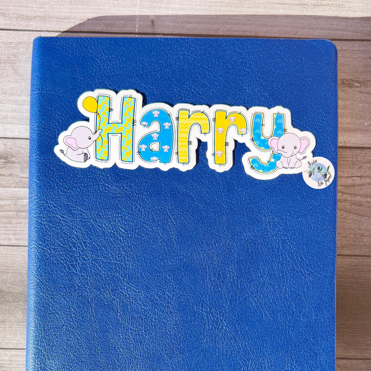 Elephants Name Sticker Label Kids - a blue note book with a Harry sticker on it