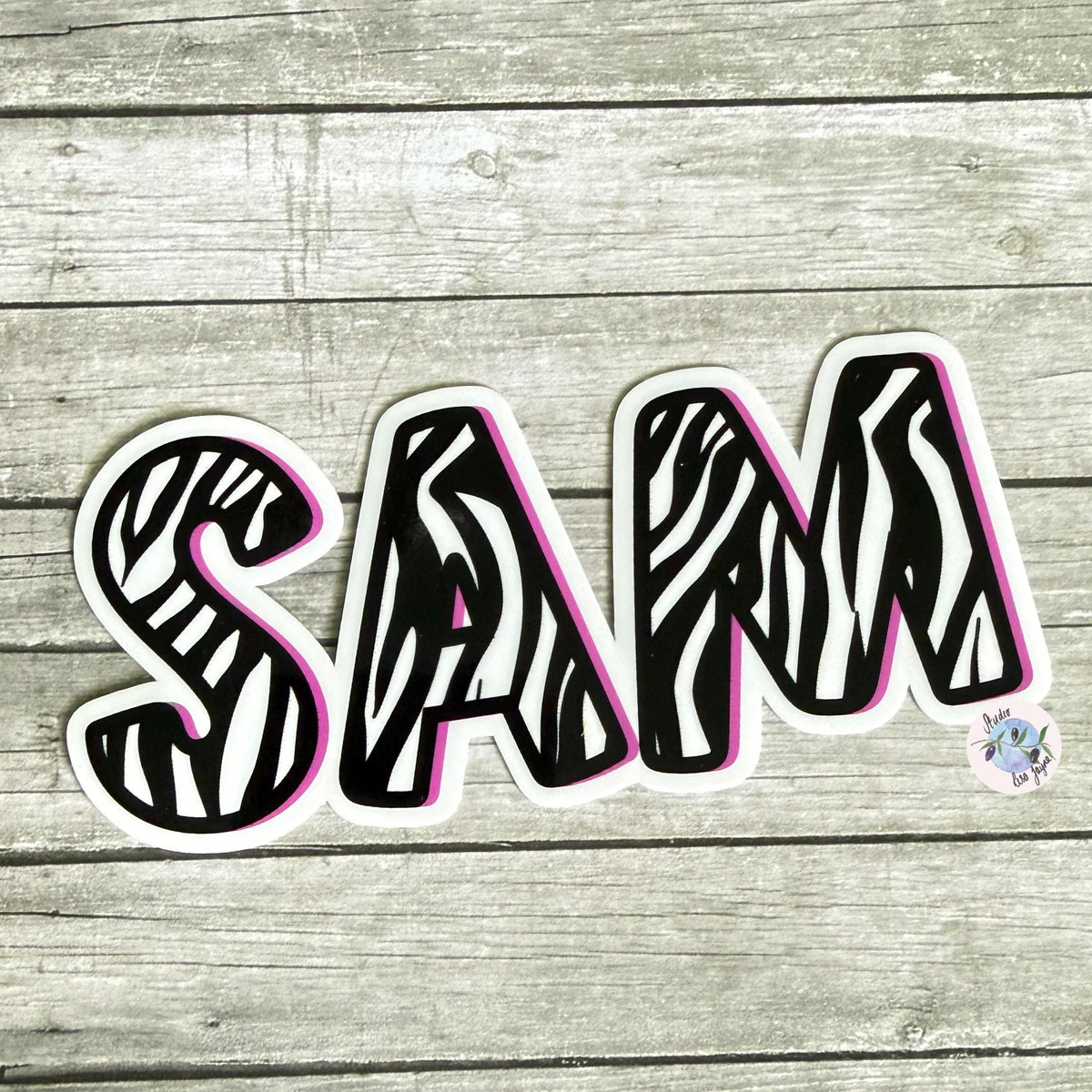 Zebra Print Name Sticker Label Kids - a sticker on a wood surface