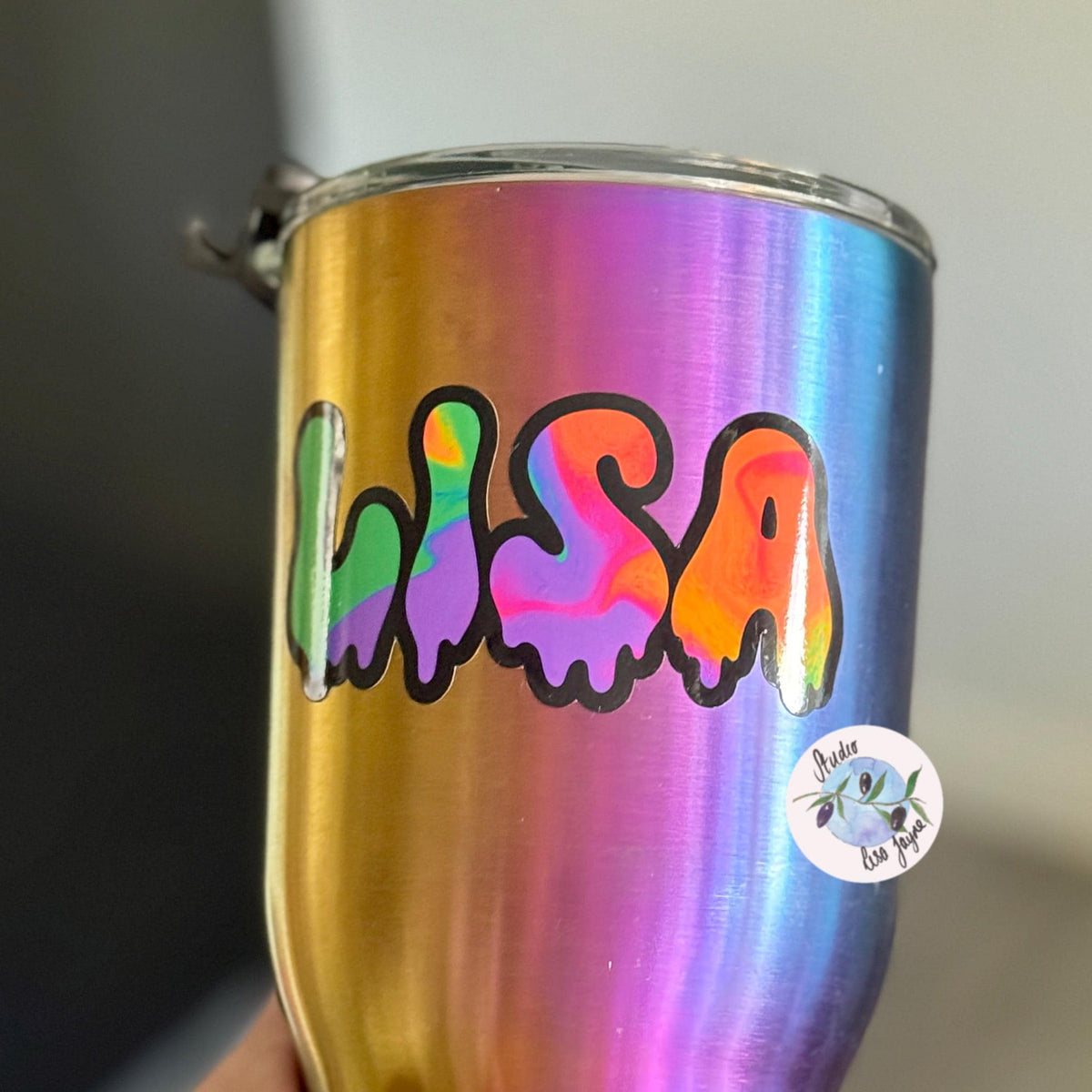 Spooky Drippy Swirly Name Personalised Halloween Waterproof Vinyl Sticker Label - a hand holding a colourful cup with Lisa name decal