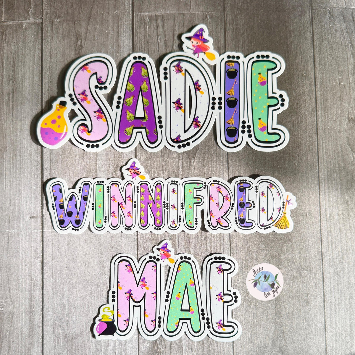 Witches and Potions Halloween Name Sticker Label Kids - a group of colorful letters on a wood surface