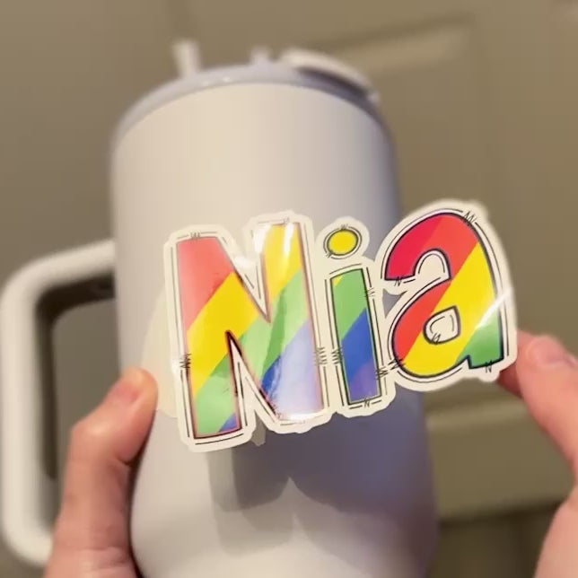 Rainbow Colourful Name Sticker applied to drink bottle