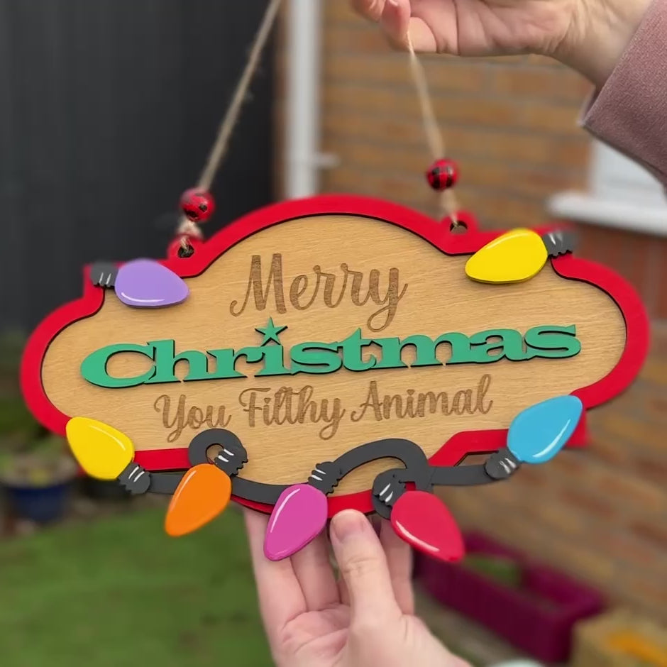 Merry Christmas You Filthy Animal Christmas hanging sign.  Quote from the movie Home Alone